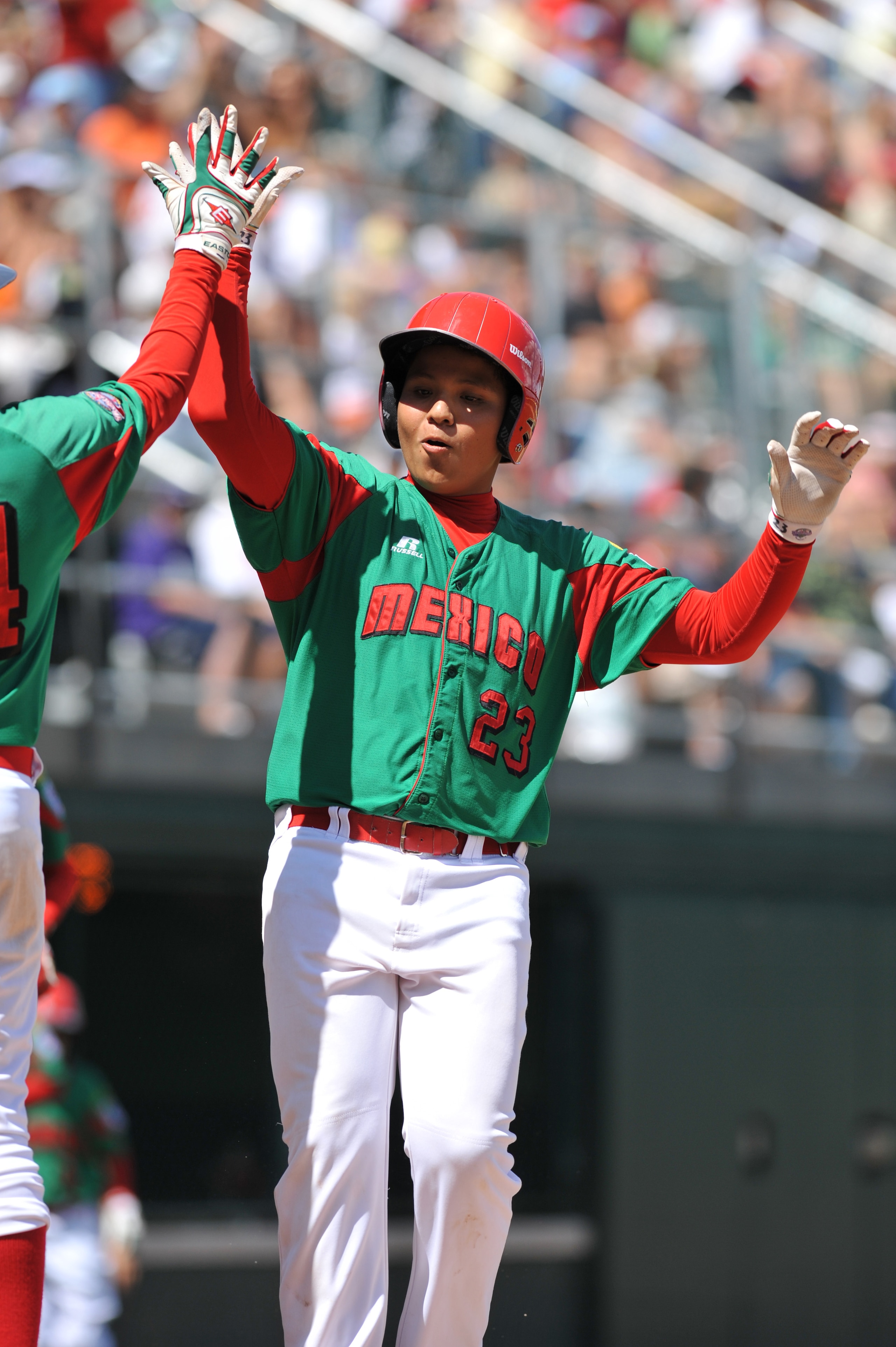 WILLIAMSPORT, PA - AUGUST 30: Third baseman Raymundo Berronnes #23 of Mexico (Reynosa) celebrates his game winning home run against Texas (San Antonio) in the consolation game at Volunteer Stadium on August 30, 2009 in Williamsport, Pennsylvania. Mexico d WILLIAMSPORT, PA - AUGUST 30: Third baseman Raymundo Berronnes #23 of Mexico (Reynosa) celebrates his game winning home run against Texas (San Antonio) in the consolation game at Volunteer Stadium on August 30, 2009 in Williamsport, Pennsylvania. Mexico d