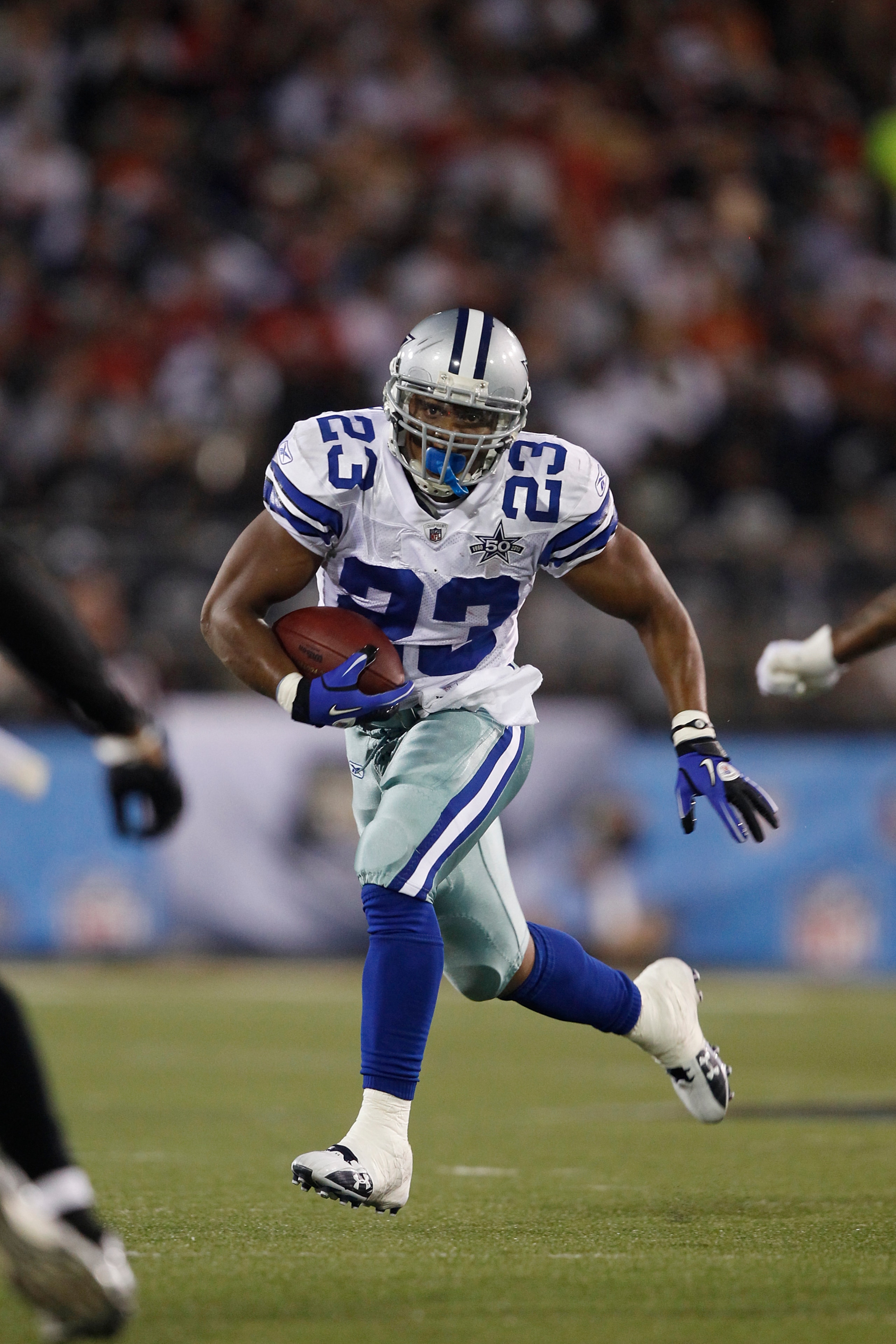 CANTON, OH - AUGUST 8: Tashard Choice #23 of the Dallas Cowboys runs with the football against the Cincinnati Bengals during the 2010 Pro Football Hall of Fame Game at the Pro Football Hall of Fame Field at Fawcett Stadium on August 8, 2010 in Canton, Ohi