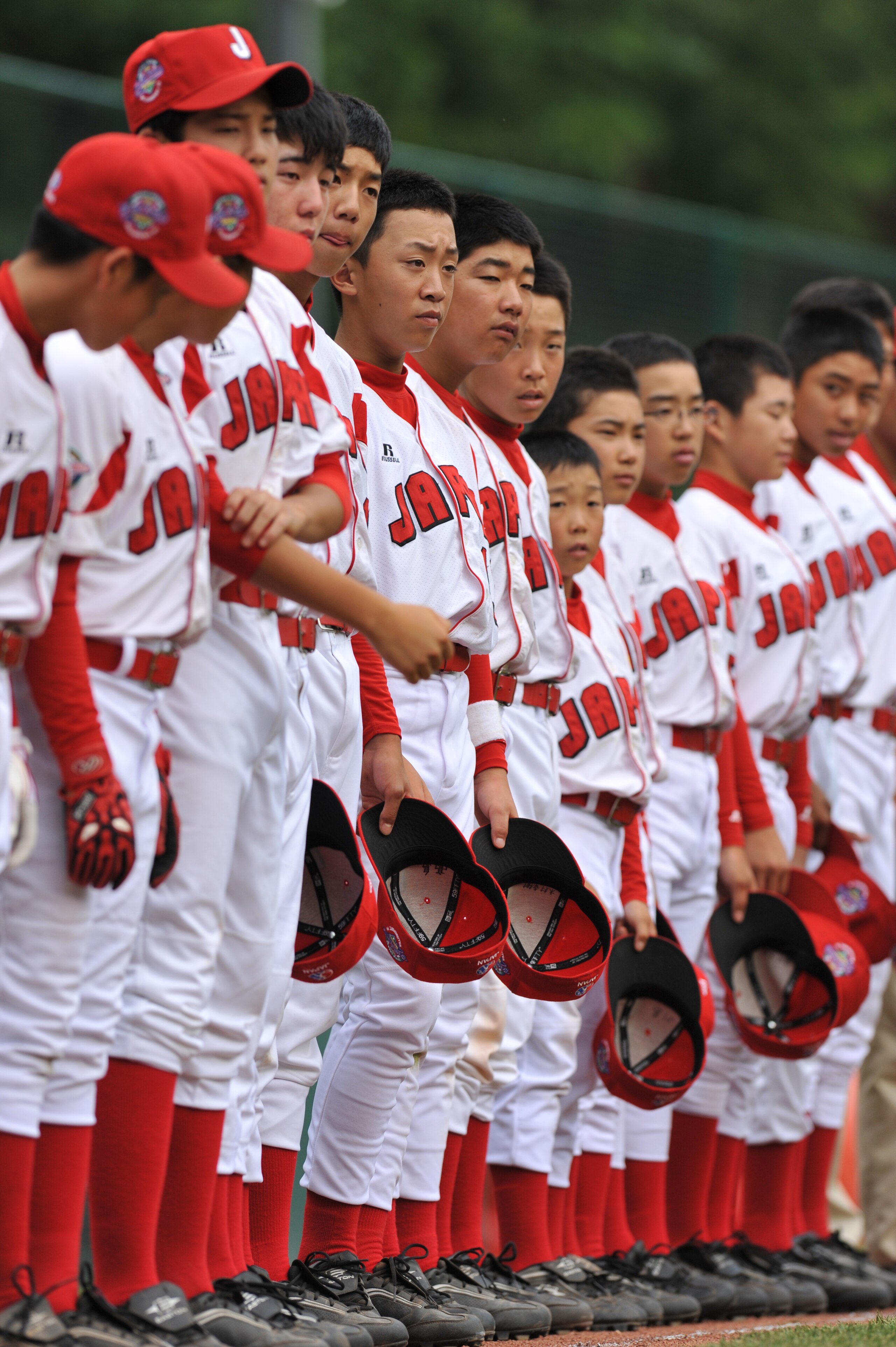 WILLIAMSPORT, PA - AUGUST 26: Chiba City, Japan players stand for the national anthems before their game against Reynosa, Mexico at the international semifinal at Lamade Stadium on August 26, 2009 in Williamsport, Pennsylvania. Reynosa, Mexico defeated Ch WILLIAMSPORT, PA - AUGUST 26: Chiba City, Japan players stand for the national anthems before their game against Reynosa, Mexico at the international semifinal at Lamade Stadium on August 26, 2009 in Williamsport, Pennsylvania. Reynosa, Mexico defeated Ch