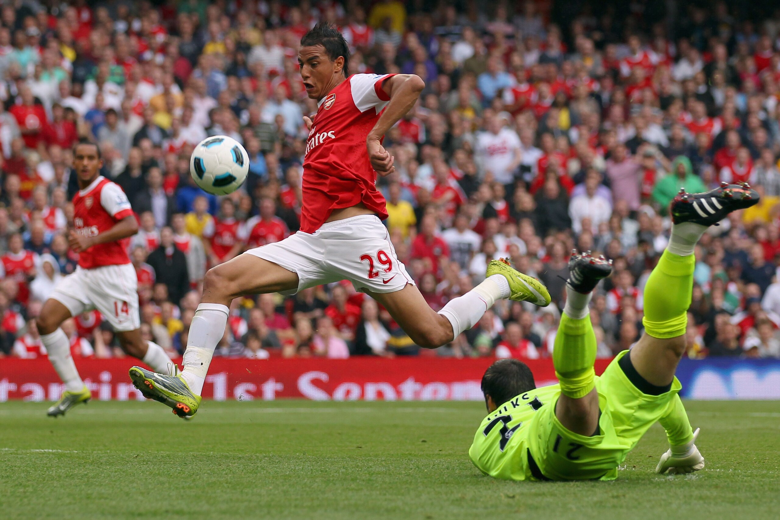 LONDON, ENGLAND - AUGUST 21: Marouane Chamakh of Arsenal is challenged by Matthew Gilks of Blackpool during the Barclays Premier League match between Arsenal and Blackpool at The Emirates Stadium on August 21, 2010 in London, England. (Photo by Clive Ros LONDON, ENGLAND - AUGUST 21: Marouane Chamakh of Arsenal is challenged by Matthew Gilks of Blackpool during the Barclays Premier League match between Arsenal and Blackpool at The Emirates Stadium on August 21, 2010 in London, England. (Photo by Clive Ros