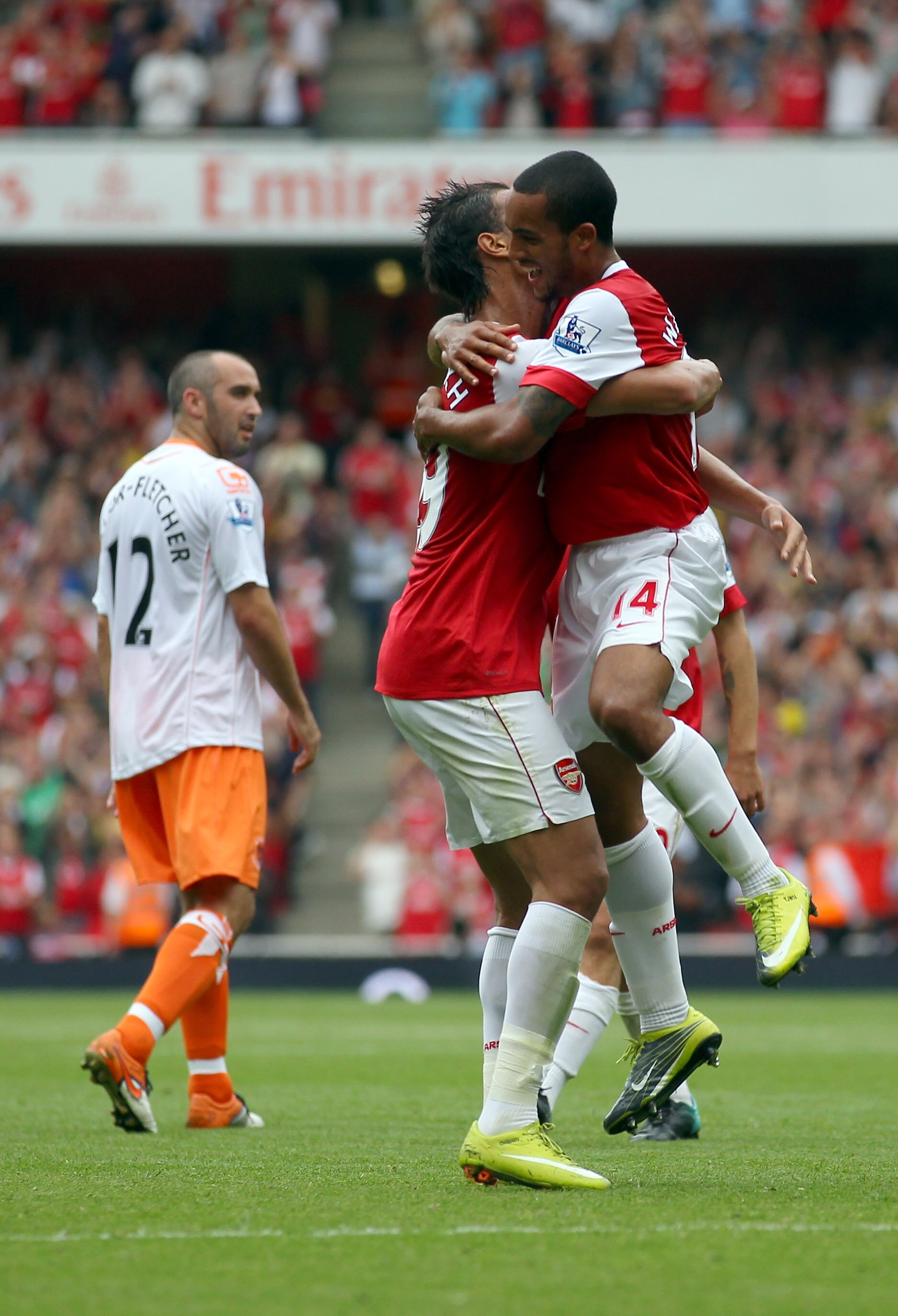 LONDON, ENGLAND - AUGUST 21:  Theo Walcott of Arsenal celebrates his second goal during the Barclays Premier League match between Arsenal and Blackpool at The Emirates Stadium on August 21, 2010 in London, England.  (Photo by Clive Rose/Getty Images)