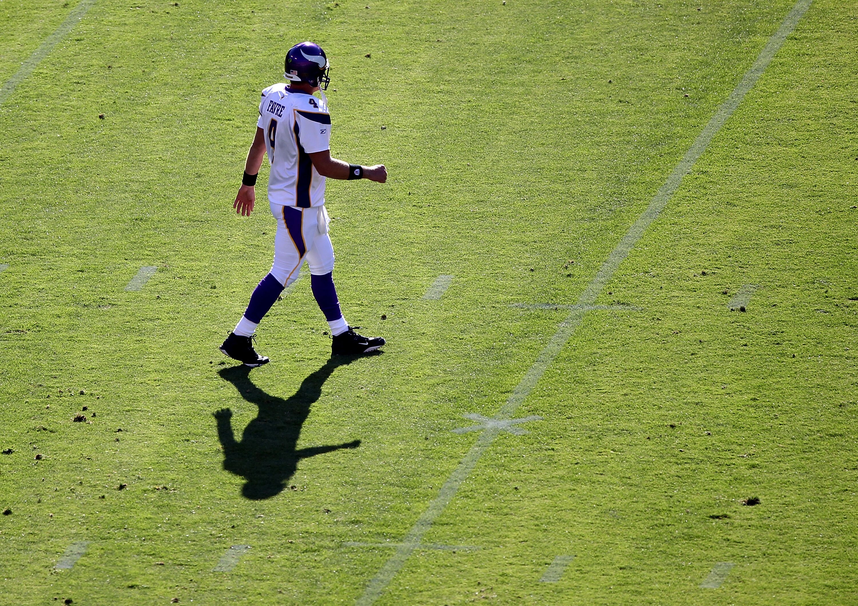 SAN FRANCISCO - AUGUST 22:  Brett Favre #4 of the Minnesota Vikings walks onto the field against the San Francisco 49ers during an NFL pre-season game at Candlestick Park on August 22, 2010 in San Francisco, California.  (Photo by Jed Jacobsohn/Getty Imag