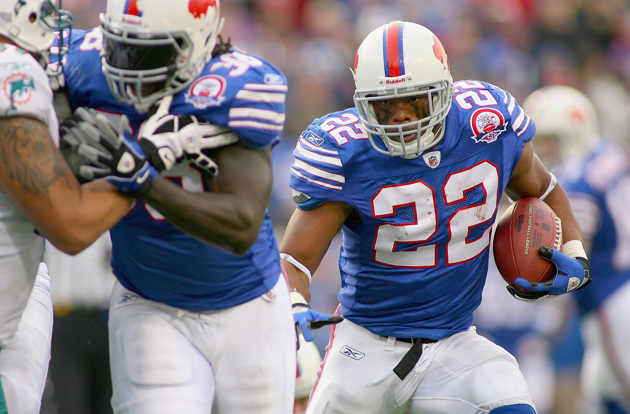 ORCHARD PARK, NY - NOVEMBER 29:  Fred Jackson #22 of the Buffalo Bills runs for his first  touchdown against  the Miami Dolphins behind a block by Corey McIntyre #38 at Ralph Wilson Stadium on November 29, 2009 in Orchard Park, New York. Buffalo won 31-14