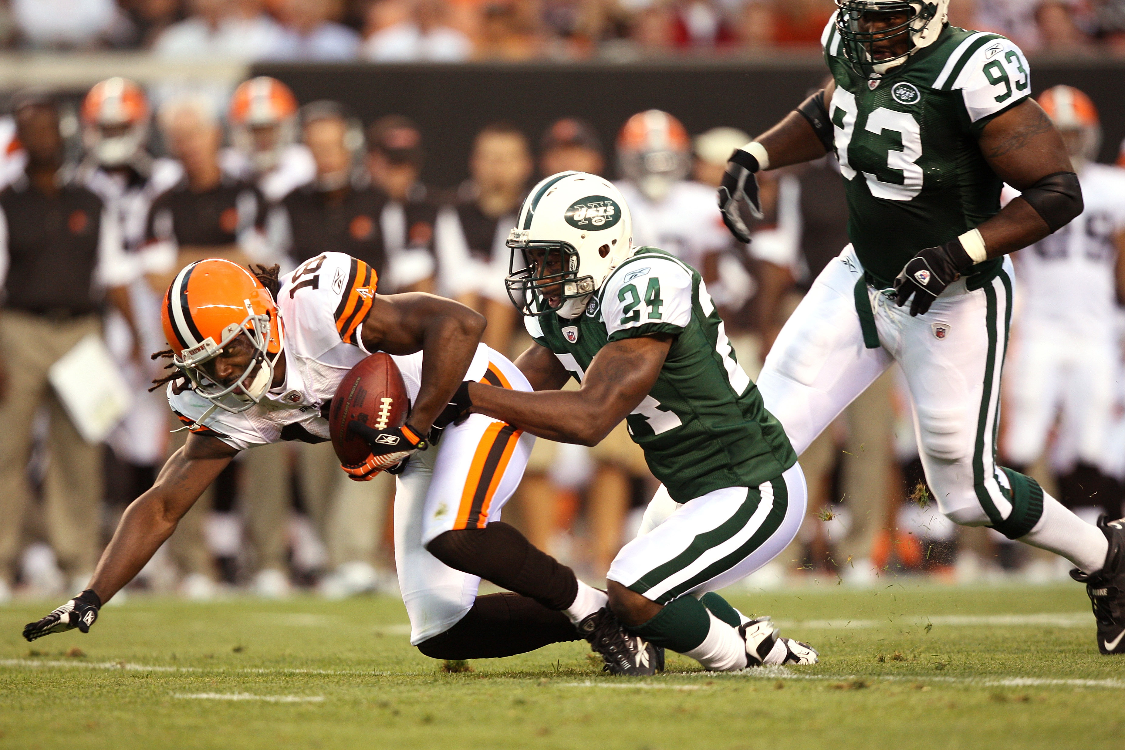 CLEVELAND, OH - AUGUST 7:  Darrelle Revis #24 of the New York Jets tackles Donte Stallworth #18 of the Cleveland Browns during the first quarter of a preseason game at Cleveland Browns Stadium on August 7, 2008 in Cleveland, Ohio. The game was suspended d