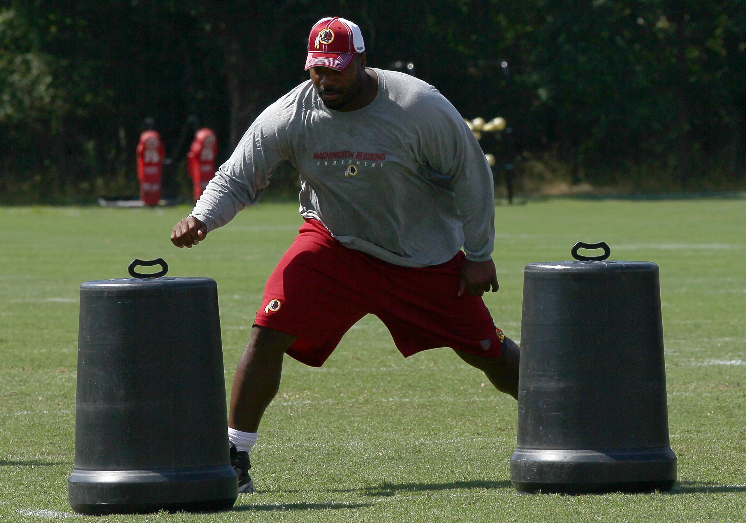 ASHBURN, VA - JULY 30:  Defensive lineman Albert Haynesworth #92 of the Washington Redskins works out following practice on the second day of training camp July 30, 2010 in Ashburn, Virginia. Haynesworth failed a team mandated conditioning test for the se
