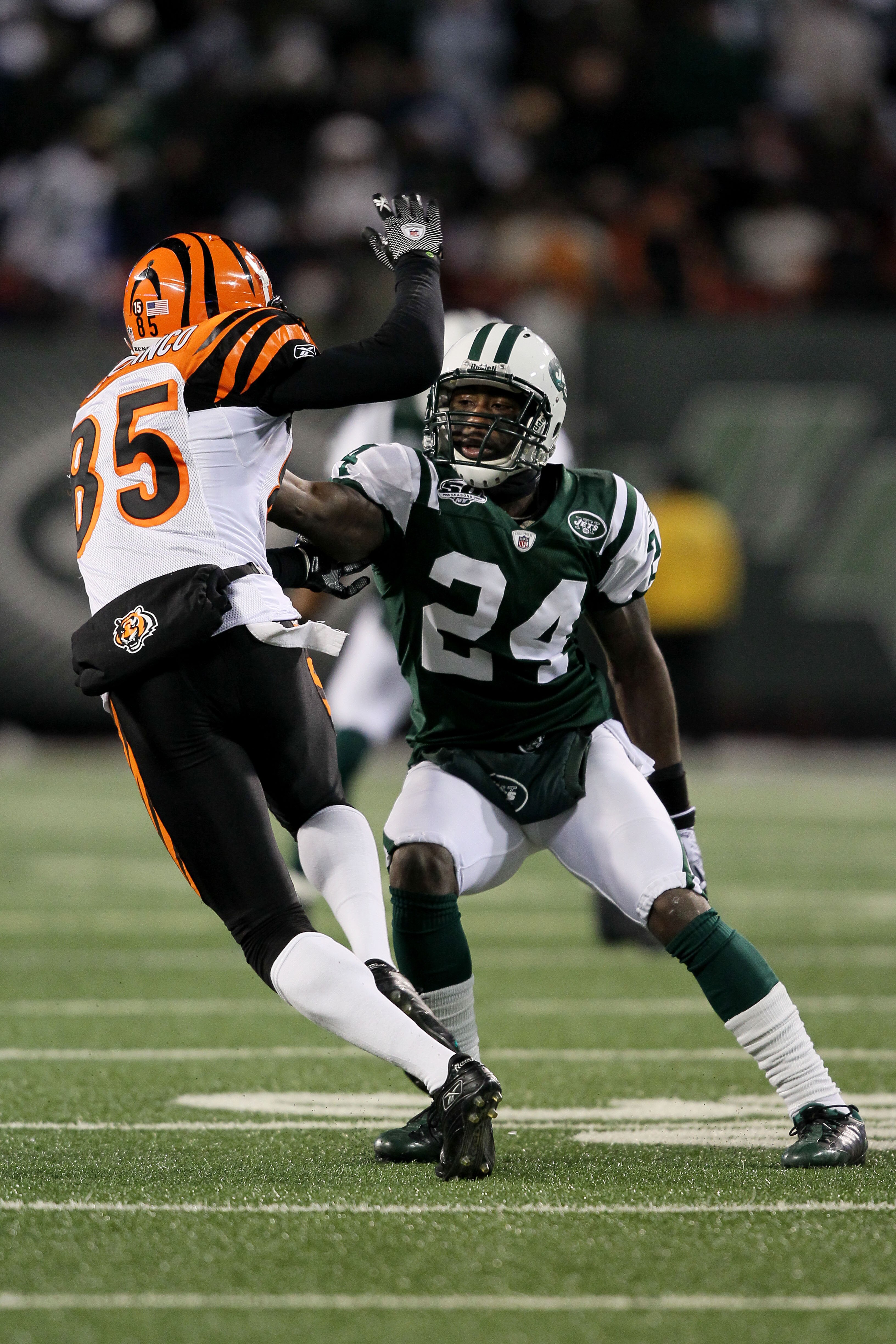 EAST RUTHERFORD, NJ - JANUARY 03:  Chad Ochocinco #85 of the Cincinnati Bengals runs past Darrelle Revis #24 of the New York Jets in the second quarter at Giants Stadium on January 3, 2010 in East Rutherford, New Jersey.  (Photo by Al Bello/Getty Images)