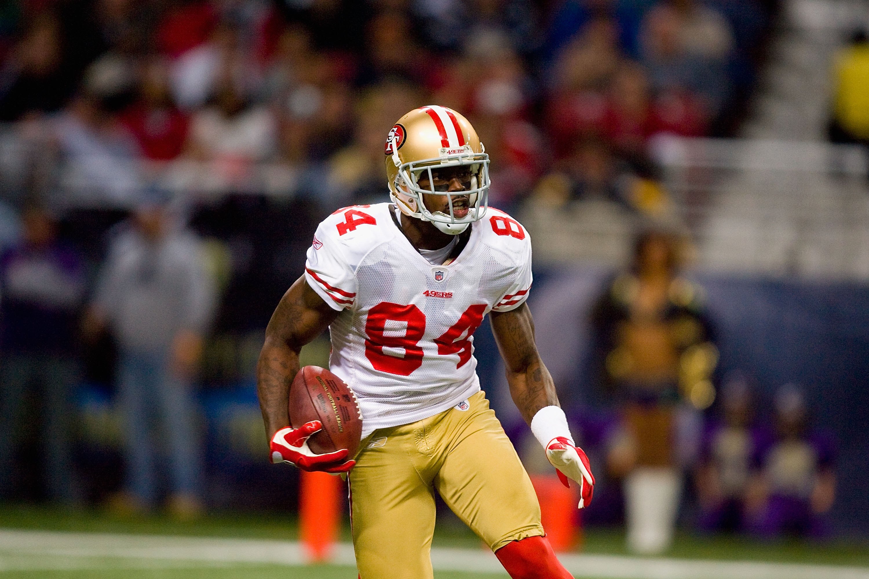 ST. LOUIS - JANUARY 3: Josh Morgan #84 of the San Francisco 49ers carries the ball during the game against the St. Louis Rams at the Edward Jones Dome on January 3, 2010 in St. Louis, Missouri.  The 49ers beat the Rams 28-6.  (Photo by Dilip Vishwanat/Get