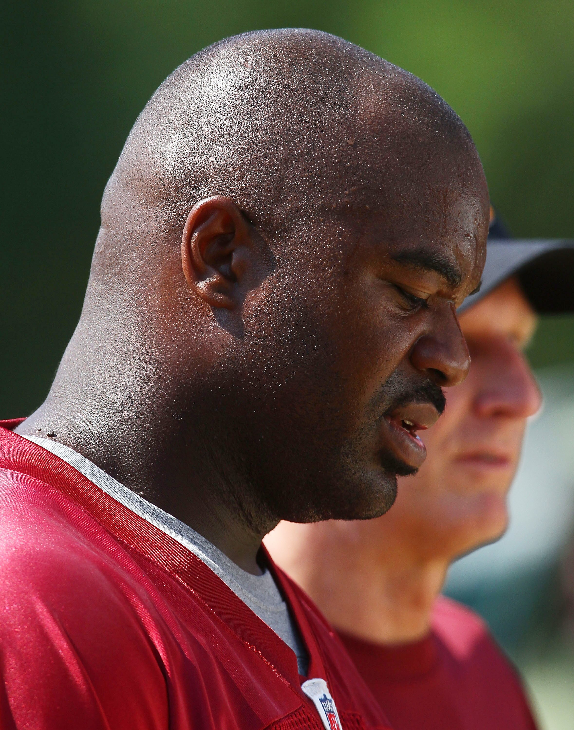 ASHBURN, VA - AUGUST 06:  Defensive lineman Albert Haynesworth #92 of the Washington Redskins walks off the field after missing his eighth consecutive day of practice during Redskins training camp on August 6, 2010 in Ashburn, Virginia.  (Photo by Win McN