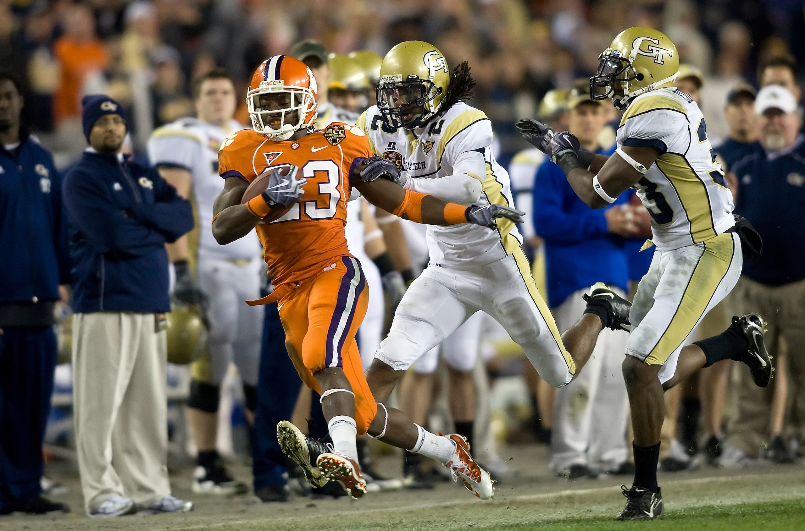 TAMPA, FL - DECEMBER 05: Running back Andre Ellington #23 of the Clemson Tigers is knocked out of bounds by defenders Mario Butler #2 and Mario Edwards #33 of the Georgia Tech Yellow Jackets in the 2009 ACC Football Championship game at Raymond James Sta TAMPA, FL - DECEMBER 05: Running back Andre Ellington #23 of the Clemson Tigers is knocked out of bounds by defenders Mario Butler #2 and Mario Edwards #33 of the Georgia Tech Yellow Jackets in the 2009 ACC Football Championship game at Raymond James Sta