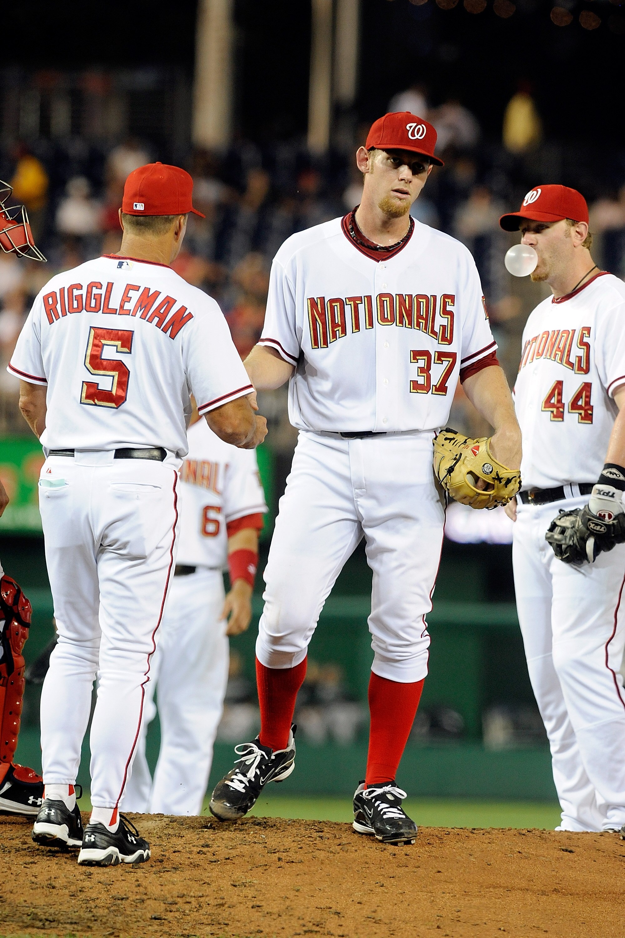 WASHINGTON - AUGUST 10:  Stephen Strasburg #37 of the Washington Nationals hands the ball to manager Jim Riggleman after being removed from the game in the fifth inning against the Florida Marlins at Nationals Park on August 10, 2010 in Washington, DC.  (