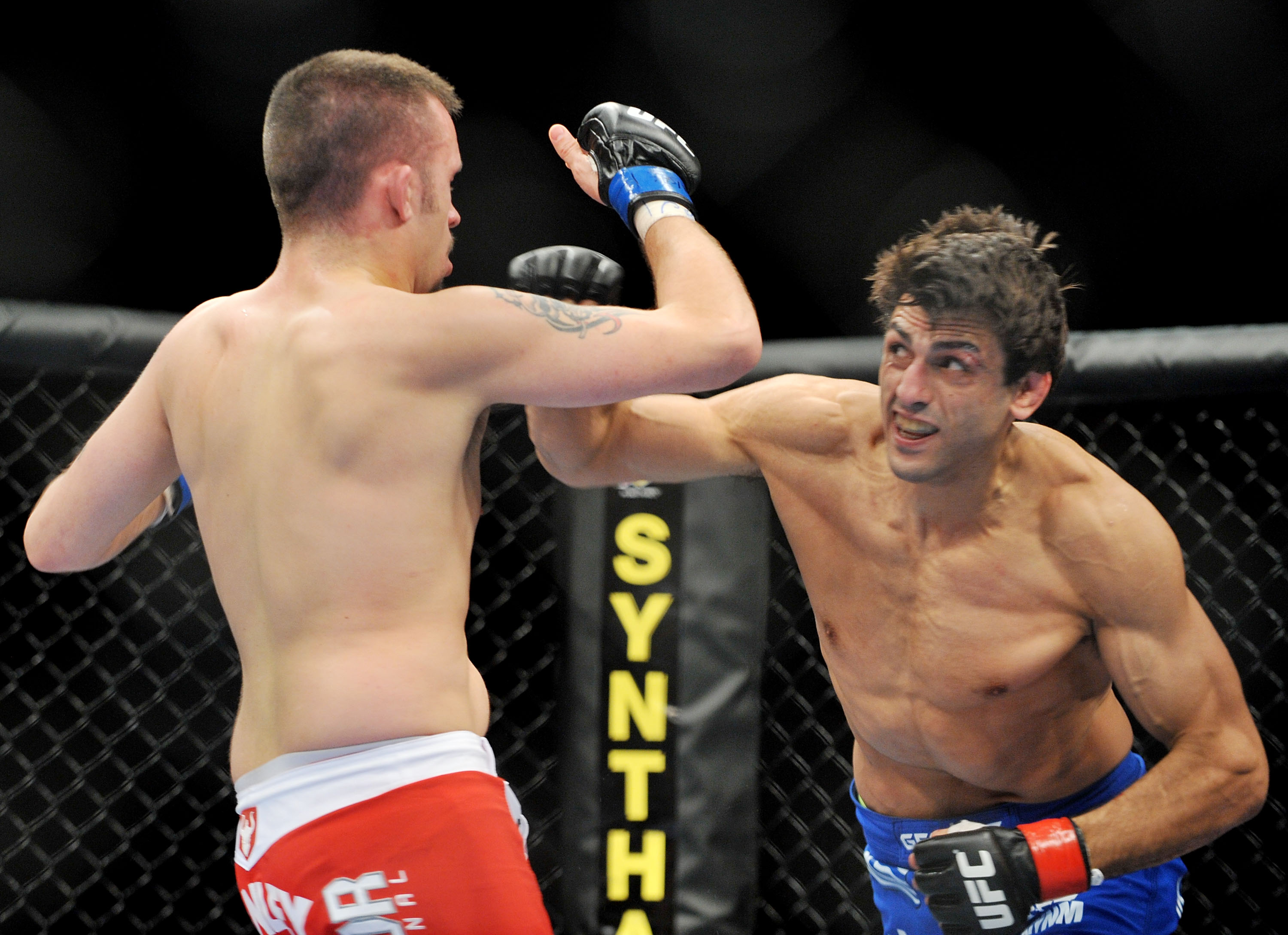 LAS VEGAS - NOVEMBER 21: Jason Dent (L) battles George Sotiropoulos (R) during their Lightweight Fight at the UFC 106 at Mandalay Bay Events Center on November 21, 2009 in Las Vegas, Nevada. (Photo by Jon Kopaloff/Getty Images)