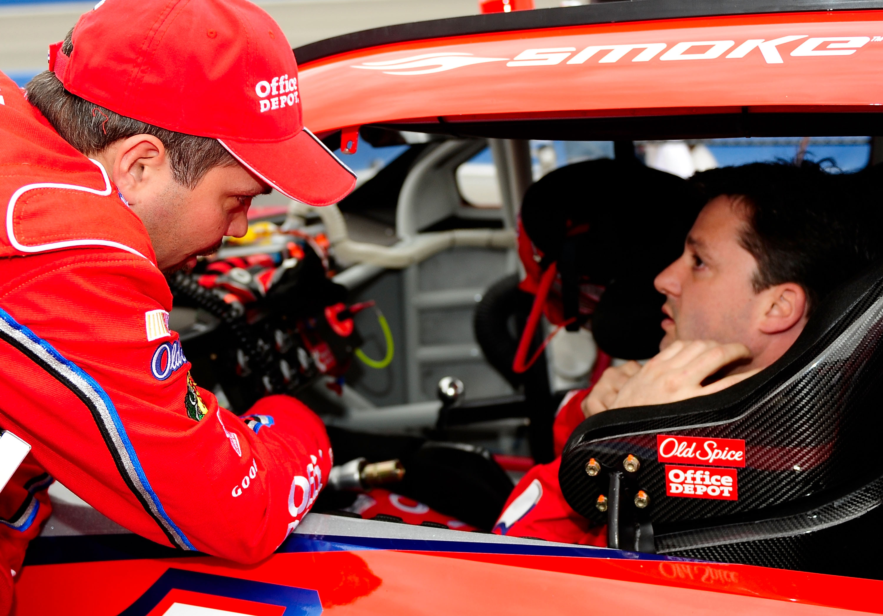 FONTANA, CA - FEBRUARY 22:  Crew chief Darian Grubb speaks with his driver Tony Stewart, driver of the #14 Old Spice/Office Depot Chevrolet on pit road prior to the start of the NASCAR Sprint Cup Series Auto Club 500 at Auto Club Speedway on February 22,