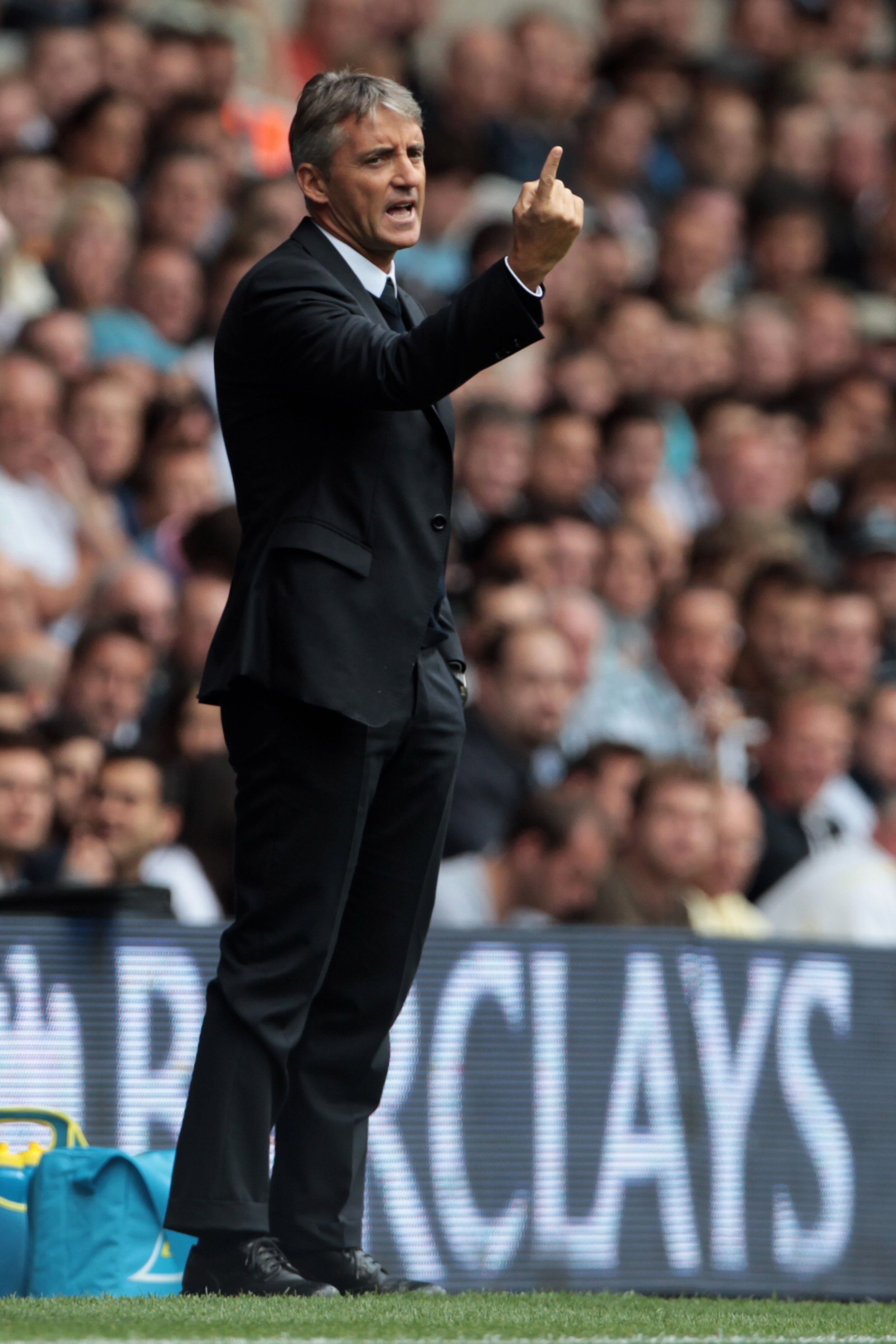LONDON, ENGLAND - AUGUST 14:  Manchester City manager Roberto Mancini reacts during the Barclays Premier League match between Tottenham Hotspur and Manchester City at White Hart Lane on August 14, 2010 in London, England.  (Photo by Phil Cole/Getty Images