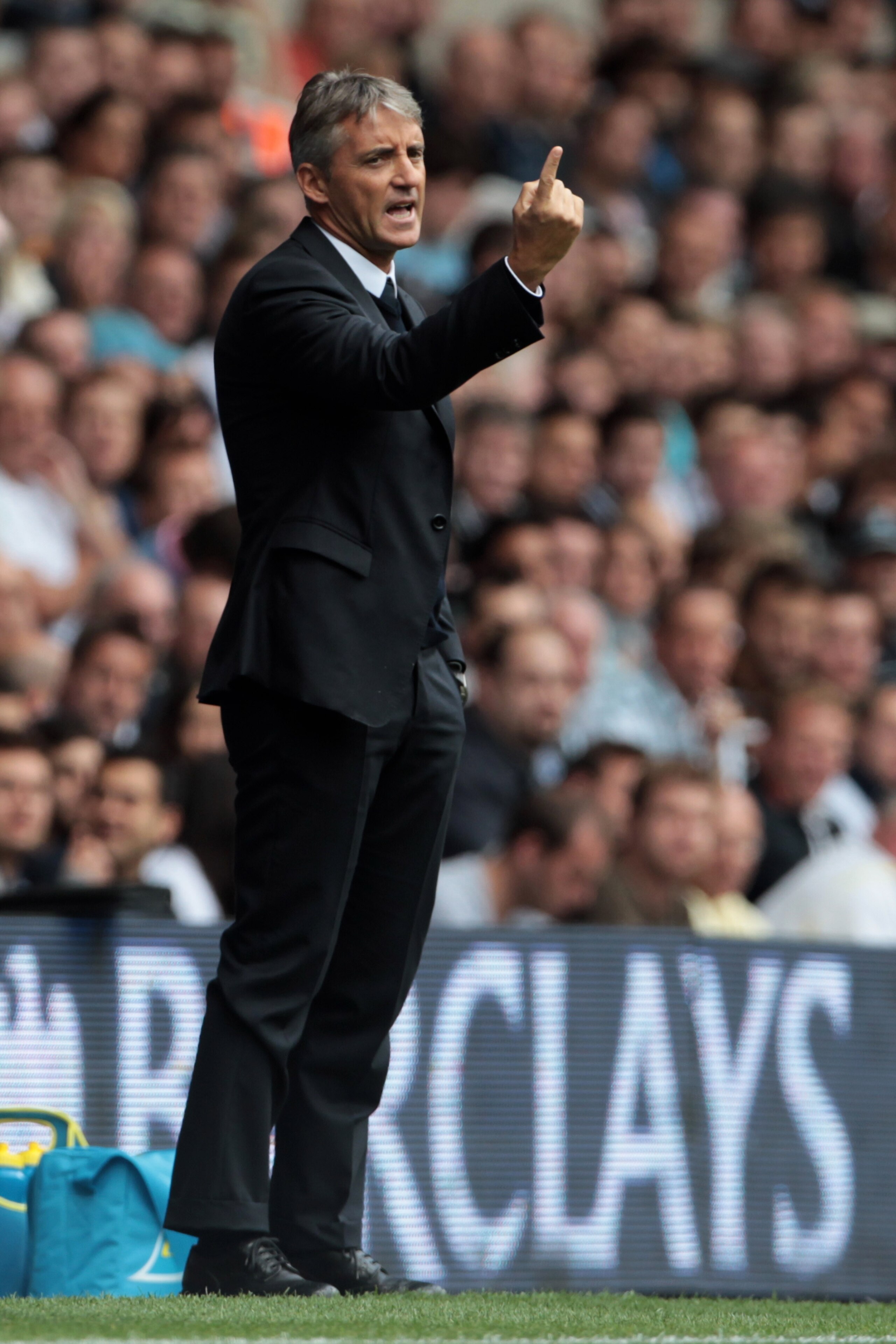 LONDON, ENGLAND - AUGUST 14:  Manchester City manager Roberto Mancini reacts during the Barclays Premier League match between Tottenham Hotspur and Manchester City at White Hart Lane on August 14, 2010 in London, England.  (Photo by Phil Cole/Getty Images