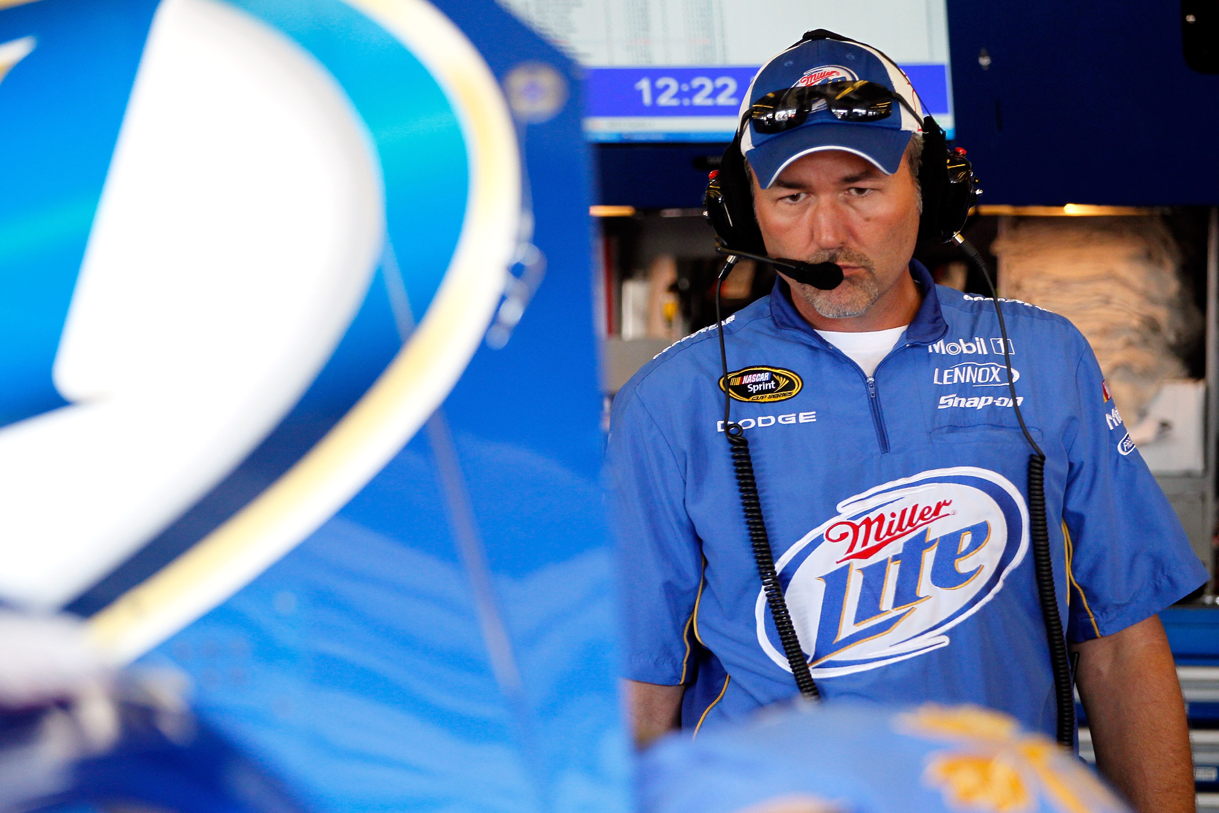 WATKINS GLEN, NY - AUGUST 06:  Steve Addington, crew chief of the #2 Miller Lite/Vortex Dodge, stands in the garage during practice for the NASCAR Heluva Good! Sour Cream Dips at The Glen on August 6, 2010 in Watkins Glen, New York.  (Photo by Kevin C. Co