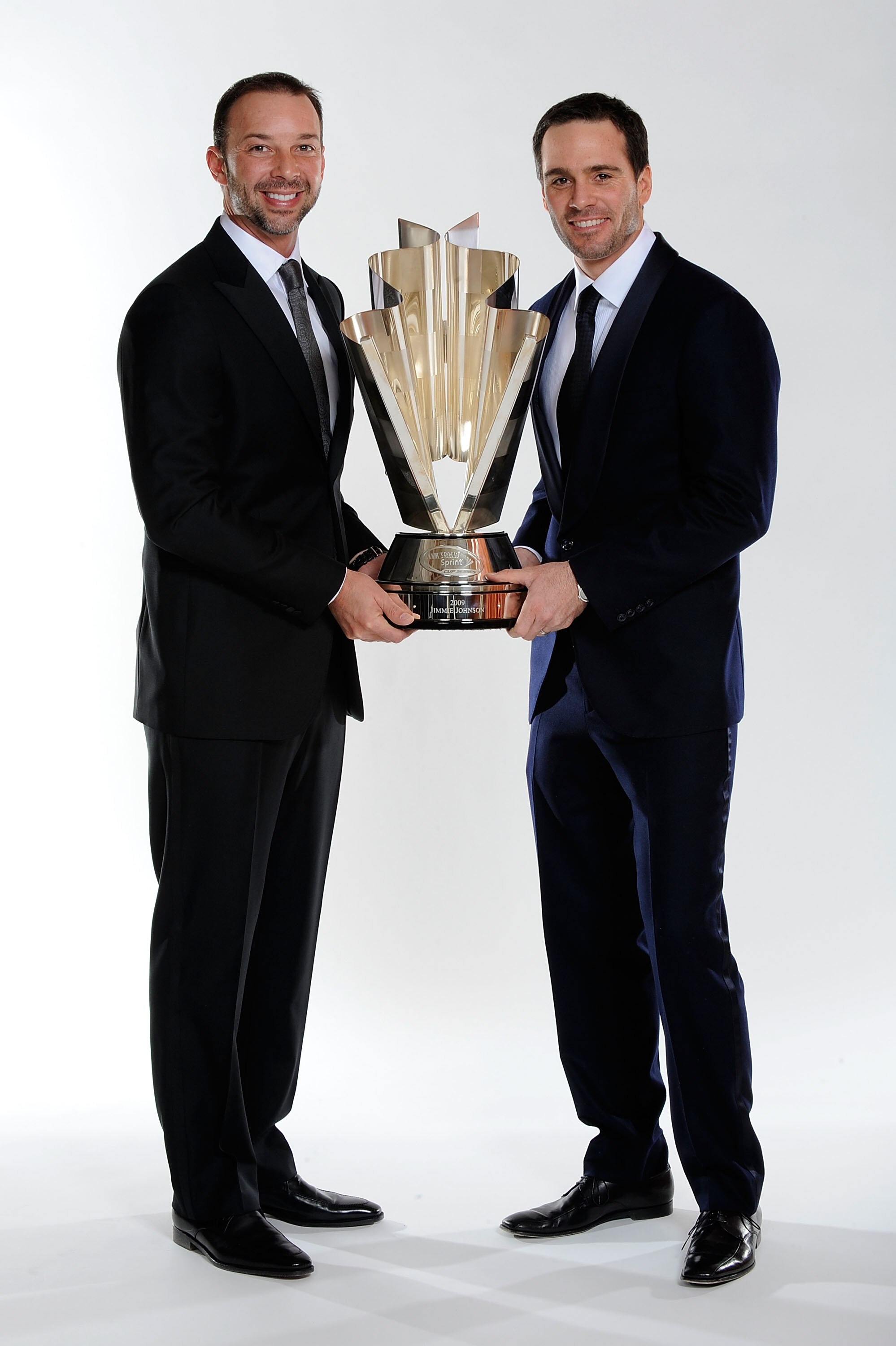 LAS VEGAS - DECEMBER 04:  Four time NASCAR Sprint Cup Series Champion Jimmie Johnson (R) and crew chief Chad Knaus pose before the NASCAR Sprint Cup Series awards banquet during the final day of the NASCAR Sprint Cup Series Champions Week on December 4, 2