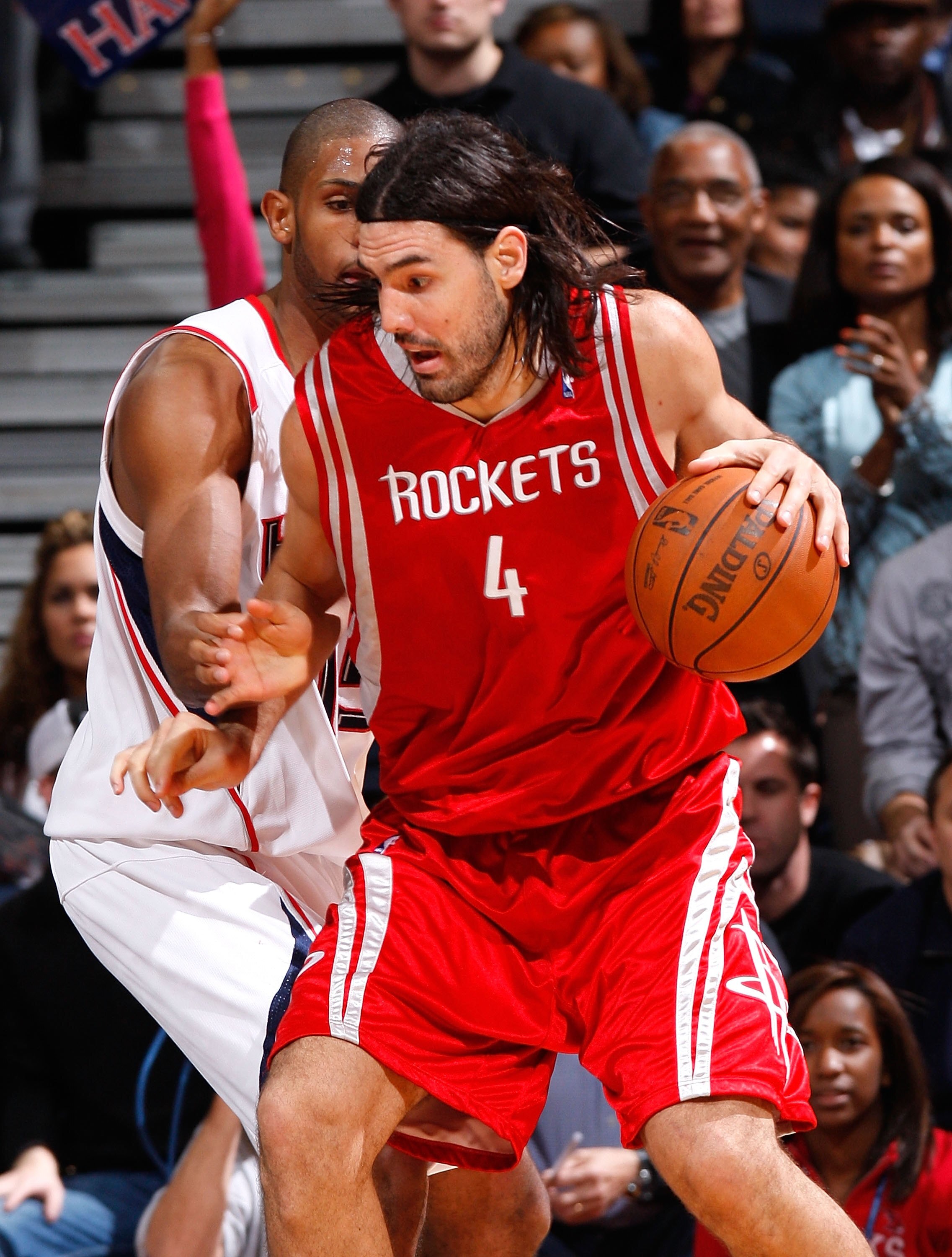 ATLANTA - NOVEMBER 20:  Luis Scola #4 of the Houston Rockets against Al Horford #15 of the Atlanta Hawks at Philips Arena on November 20, 2009 in Atlanta, Georgia.  NOTE TO USER: User expressly acknowledges and agrees that, by downloading and/or using thi