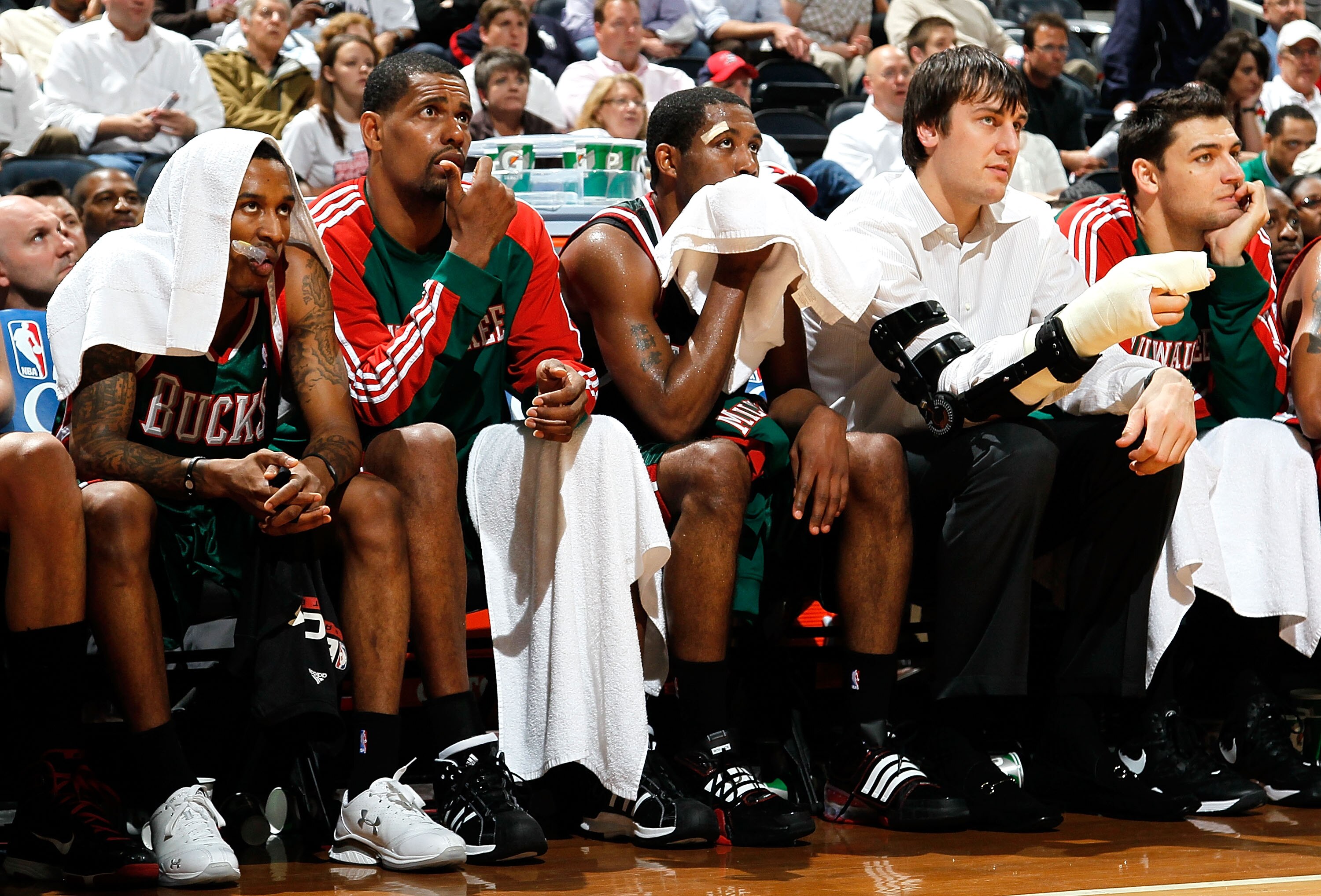 ATLANTA - APRIL 20:  (L-R) Brandon Jennings #3, Kurt Thomas #40, John Salmons #15, Andrew Bogut #6 and Carlos Delfino #10 of the Milwaukee Bucks look on from the bench in the final minute of their 96-86 loss to the Atlanta Hawks at Philips Arena on April