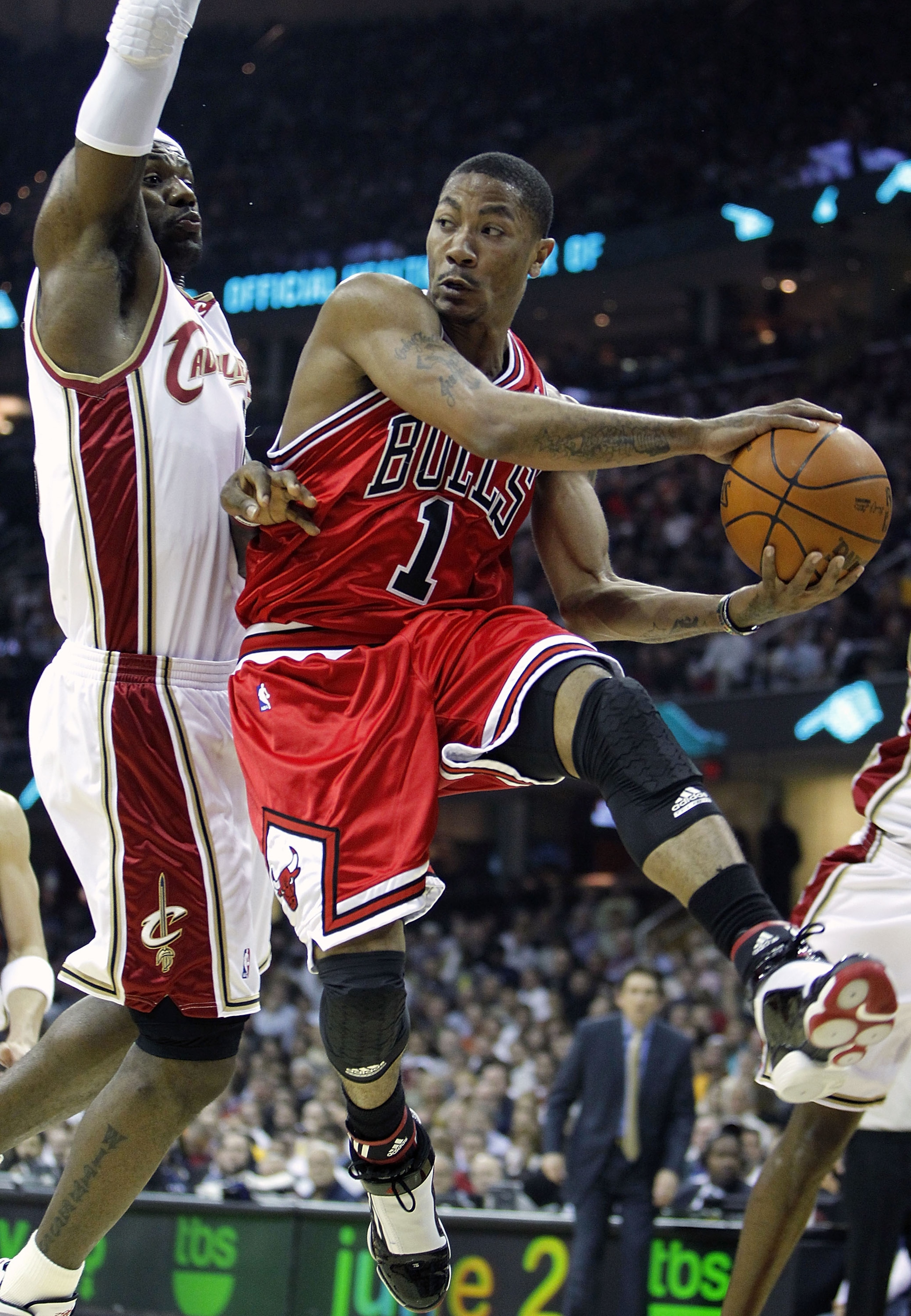 CLEVELAND - APRIL 27: Derrick Rose #1 of the Chicago Bulls looks to pass the ball around LeBron James #23 of the Cleveland Cavaliers in Game Five of the Eastern Conference Quarterfinals during the 2010 NBA Playoffs at Quicken Loans Arena on April 27, 201 CLEVELAND - APRIL 27: Derrick Rose #1 of the Chicago Bulls looks to pass the ball around LeBron James #23 of the Cleveland Cavaliers in Game Five of the Eastern Conference Quarterfinals during the 2010 NBA Playoffs at Quicken Loans Arena on April 27, 201