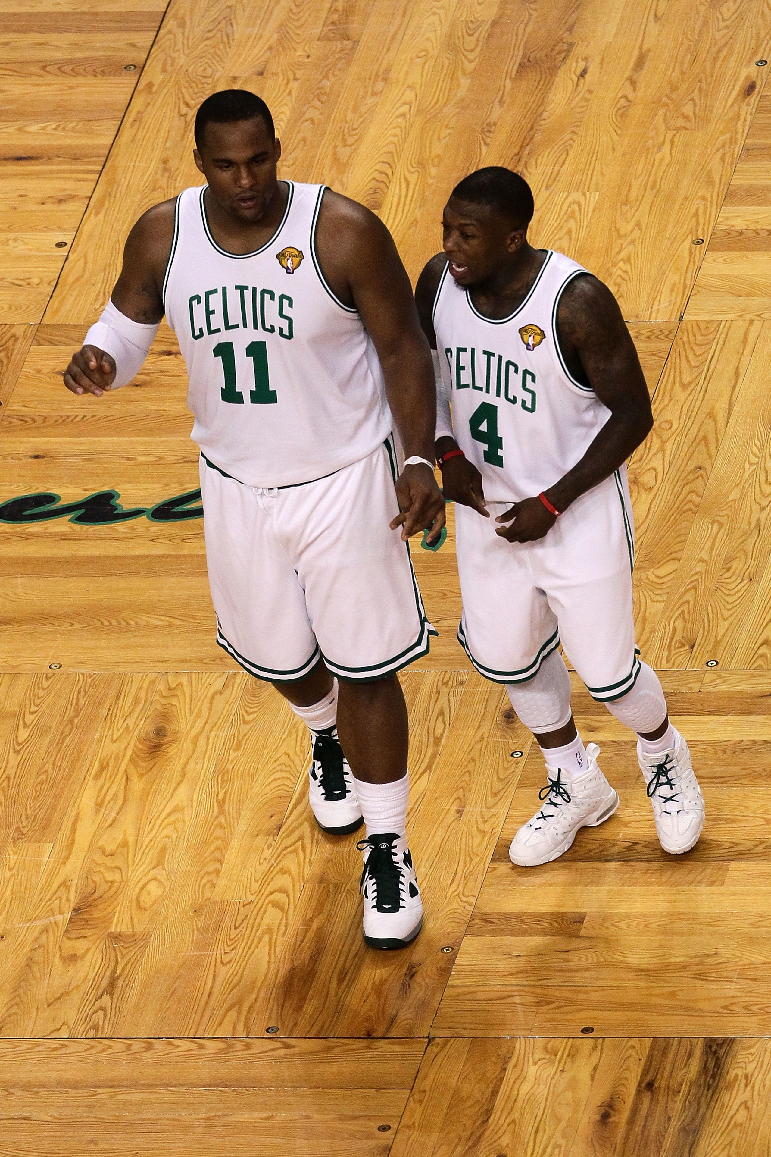 BOSTON - JUNE 10: (L-R) Glen Davis #11 and Nate Robinson #4 of the Boston Celltics talk on court against the Los Angeles Lakers during Game Four of the 2010 NBA Finals on June 10, 2010 at TD Garden in Boston, Massachusetts. NOTE TO USER: User expressly a BOSTON - JUNE 10: (L-R) Glen Davis #11 and Nate Robinson #4 of the Boston Celltics talk on court against the Los Angeles Lakers during Game Four of the 2010 NBA Finals on June 10, 2010 at TD Garden in Boston, Massachusetts. NOTE TO USER: User expressly a