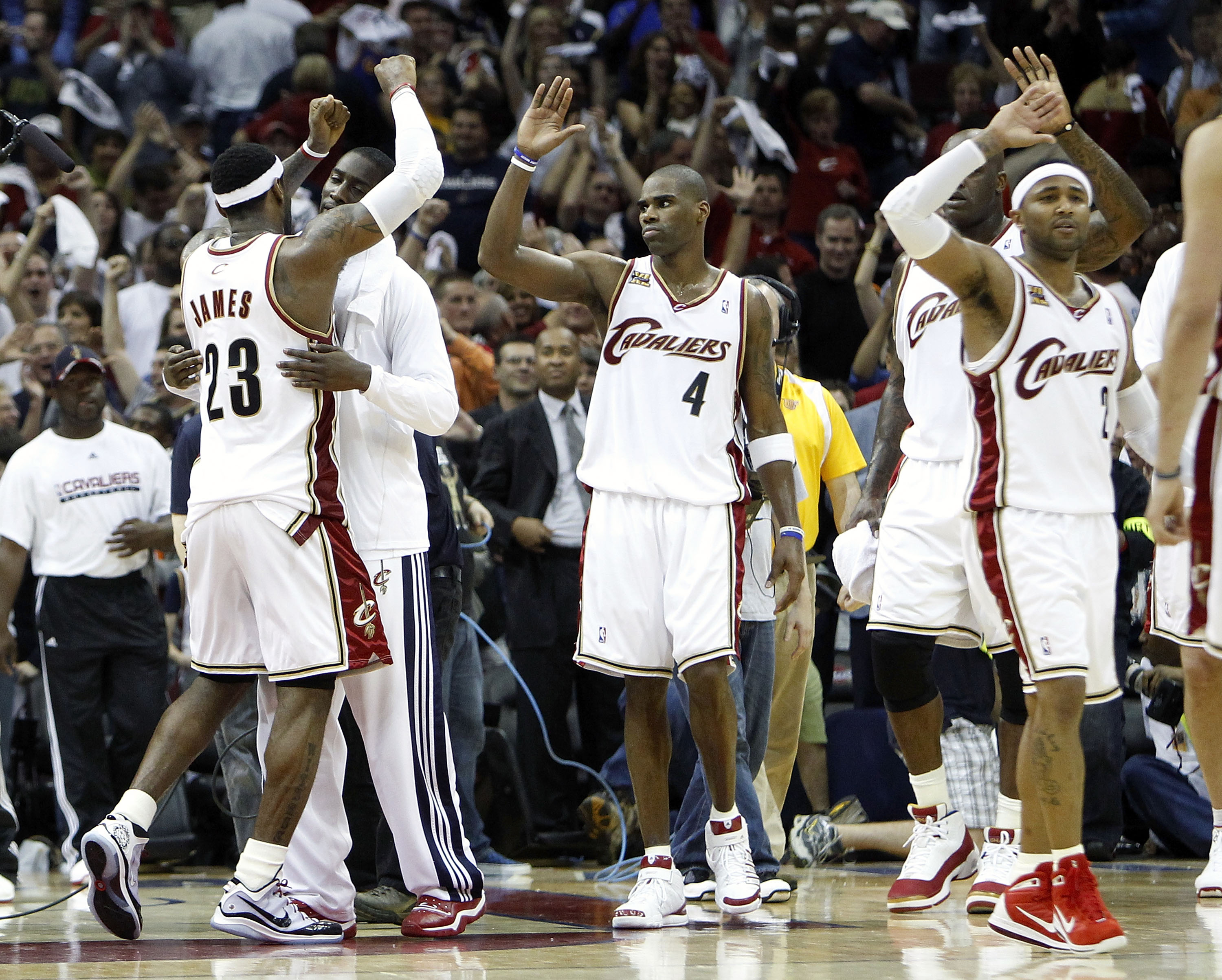 CLEVELAND - MAY 01:  LeBron James #23 of the Cleveland Cavaliers celebrates with J.J. Hickson #21 and Antawn Jamison #4 after beating the Boston Celtics 101-93 in Game One of the Eastern Conference Semifinals during the 2010 NBA Playoffs at Quicken Loans