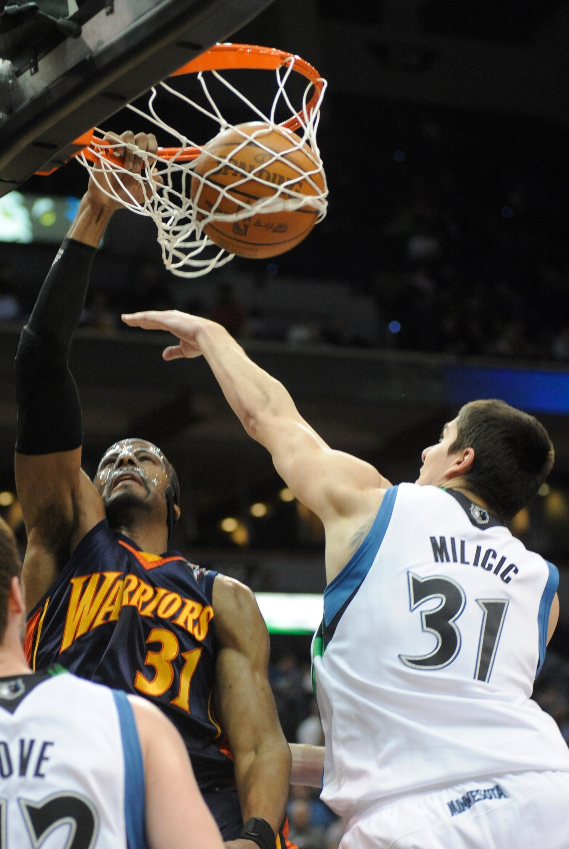 MINNEAPOLIS, MN - APRIL 7: Chris Hunter #31 of the Golden State Warriors dunks against Darko Milicic #31 of the Minnesota Timberwolves in the first half during a basketball game at Target Center on April 7, 2010 in Minneapolis, Minnesota.  NOTE TO USER: