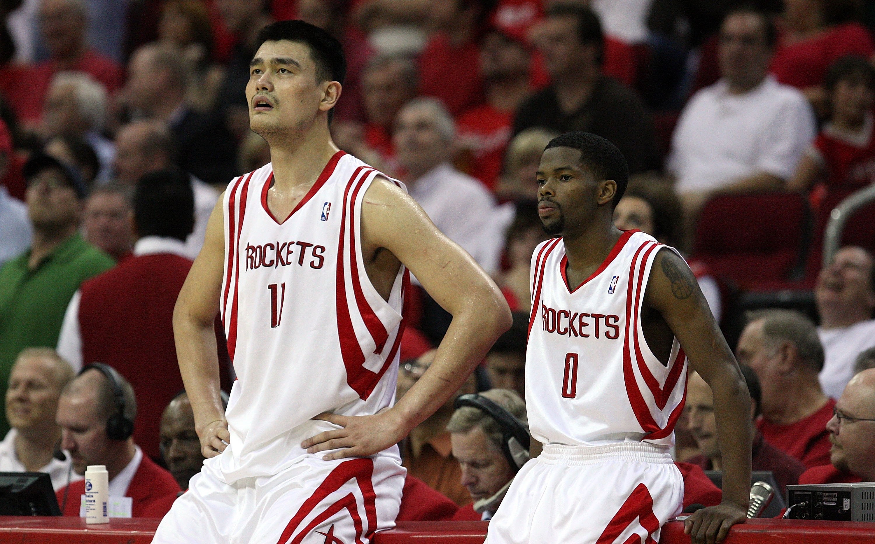 HOUSTON - APRIL 30:  Center Yao Ming #11  and Aaron Brooks #0 of the Houston Rockets in Game Six of the Western Conference Quarterfinals during the 2009 NBA Playoffs at Toyota Center on April 30, 2009 in Houston, Texas. NOTE TO USER: User expressly acknow