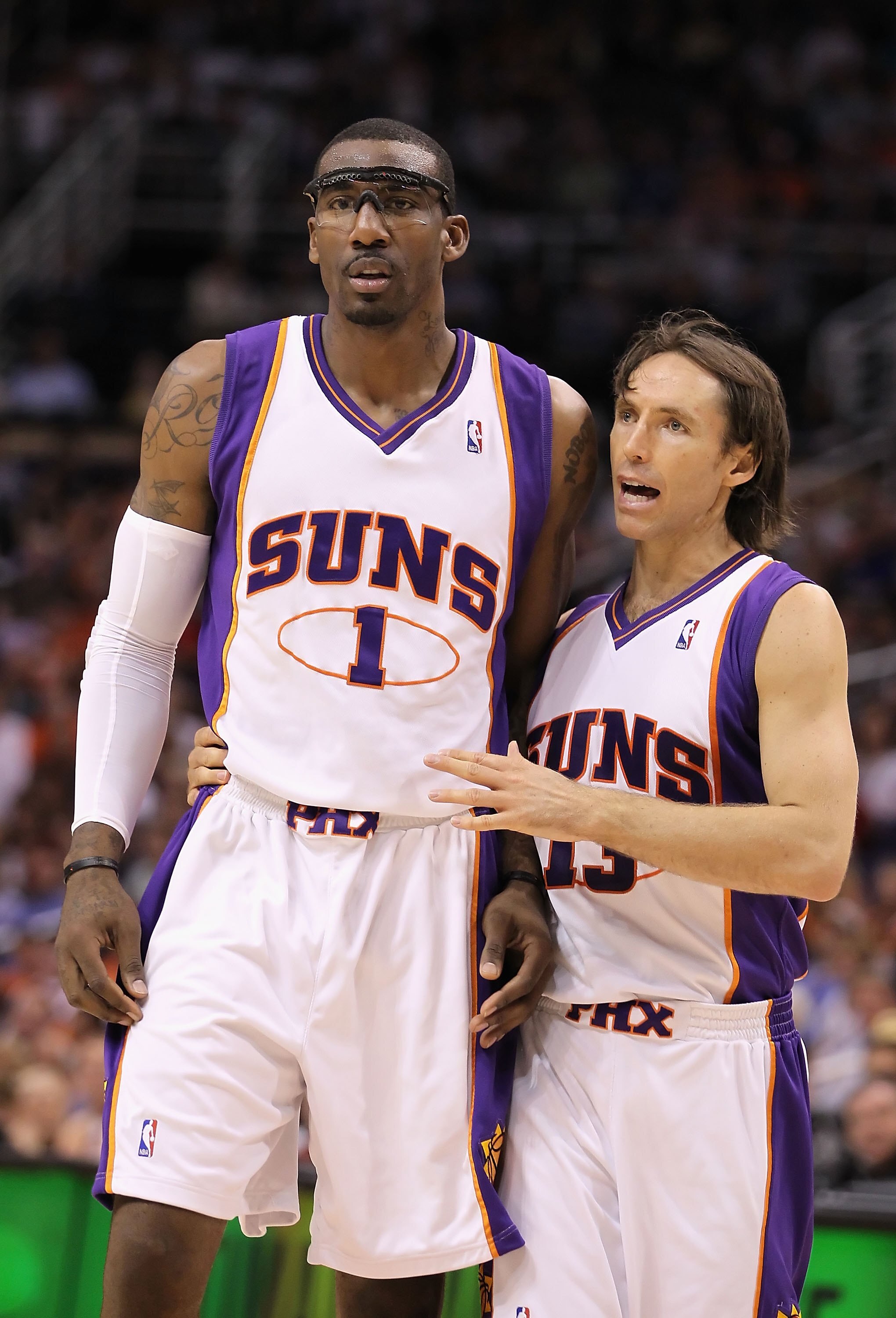 PHOENIX - APRIL 13:  Amar'e Stoudemire #1 and Steve Nash #13 of the Phoenix Suns walk upcourt during the NBA game against the Denver Nuggets at US Airways Center on April 13, 2010 in Phoenix, Arizona. The Suns defeated the Nuggets 123-101. NOTE TO USER: U