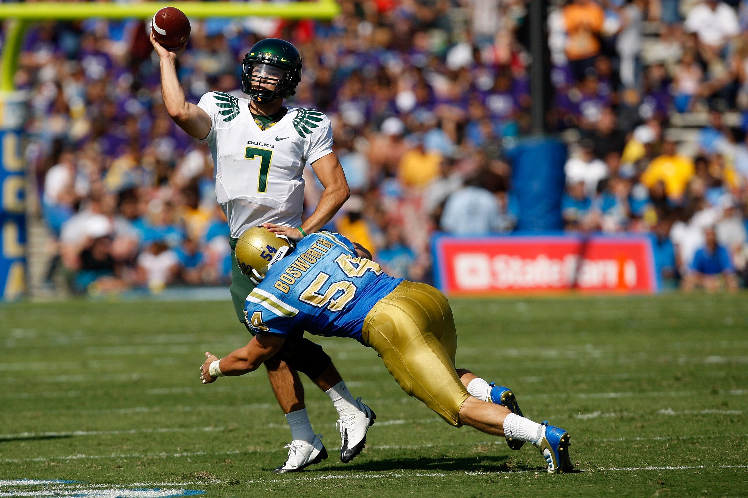 PASADENA, CA. - OCTOBER 10: Kyle Bosworth #54 of the UCLA Bruins hits Nate Costa #7 the Oregon Ducks on October 10, 2009 at the Rosebowl in Pasadena, California. The Ducks defeated the Bruins 24-10 (Photo by Jacob De golish/Getty Images) PASADENA, CA. - OCTOBER 10: Kyle Bosworth #54 of the UCLA Bruins hits Nate Costa #7 the Oregon Ducks on October 10, 2009 at the Rosebowl in Pasadena, California. The Ducks defeated the Bruins 24-10 (Photo by Jacob De golish/Getty Images)