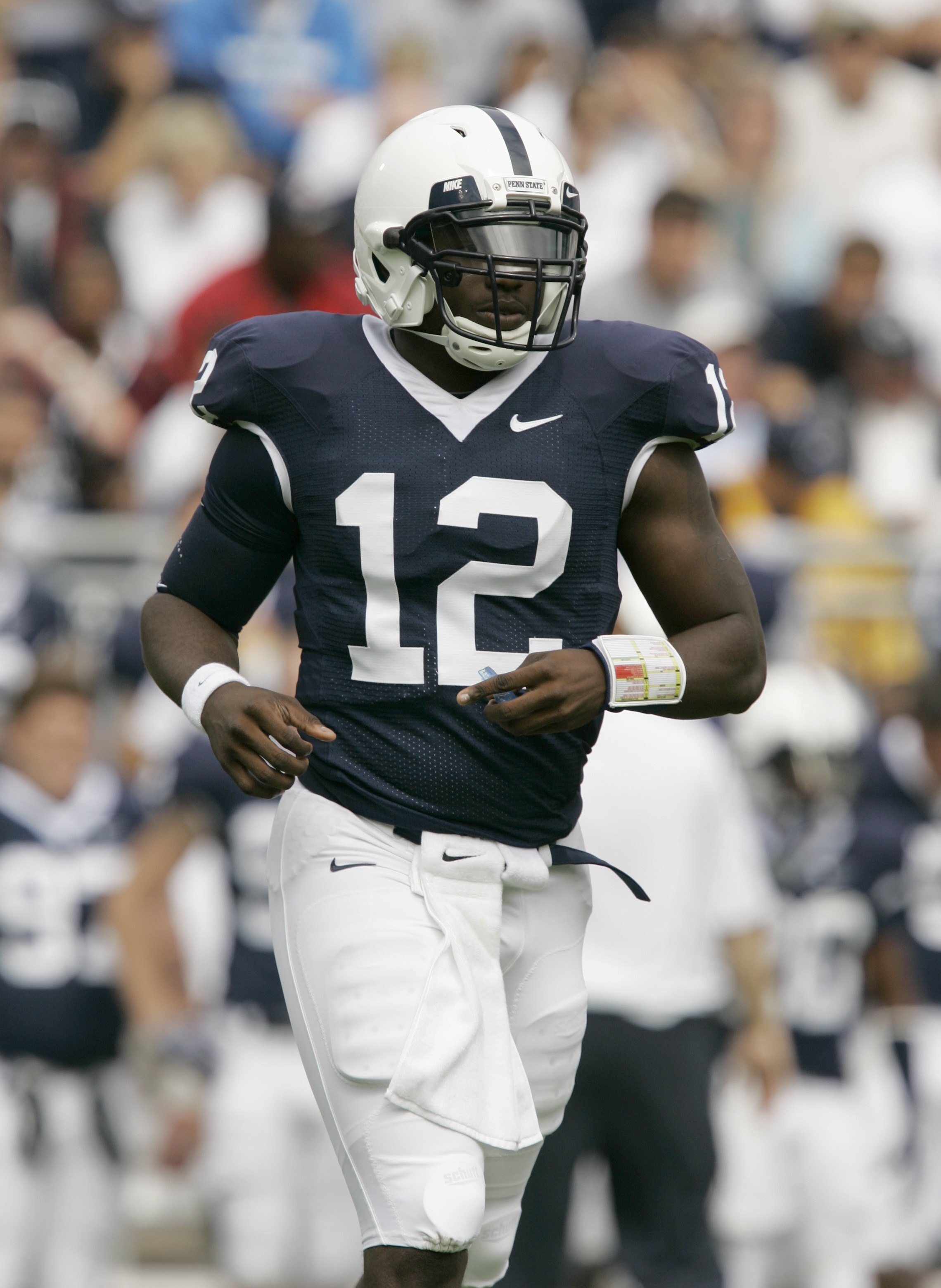 STATE COLLEGE, PA - SEPTEMBER 12: Quarterback Kevin Newsome #12 of the Penn State Nittany Lions  jogs on the field against the Syracuse Orangemen during the second half at Beaver Stadium  September 12, 2009 in State College, Pennsylvania. Penn State won 2