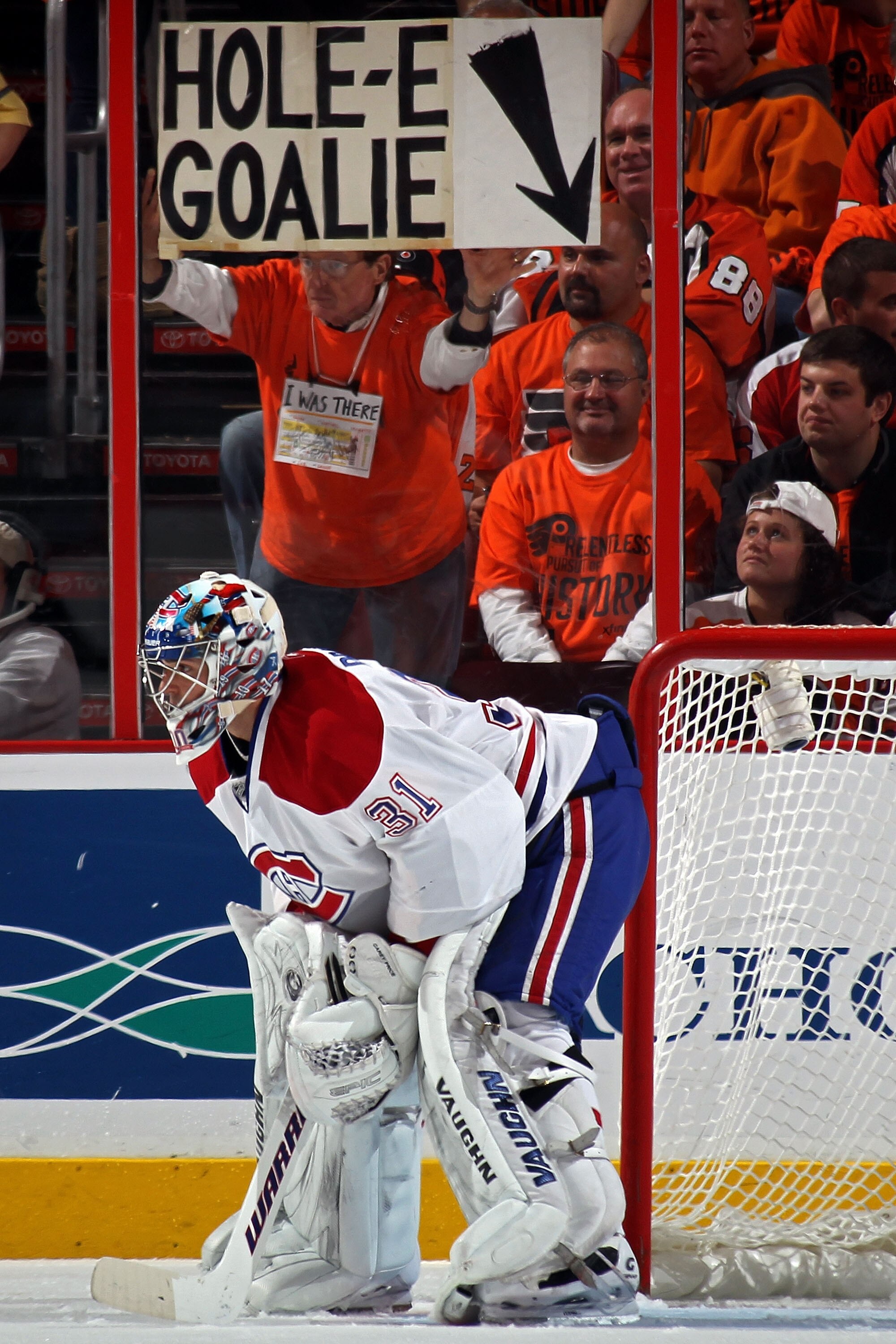 PHILADELPHIA - MAY 16:  A fan of the Philadelphia Flyers holds up a sign reading 'Hole-E Goalie' behind goalie Carey Price #31 of the Montreal Canadiens in Game 1 of the Eastern Conference Finals during the 2010 NHL Stanley Cup Playoffs at Wachovia Center