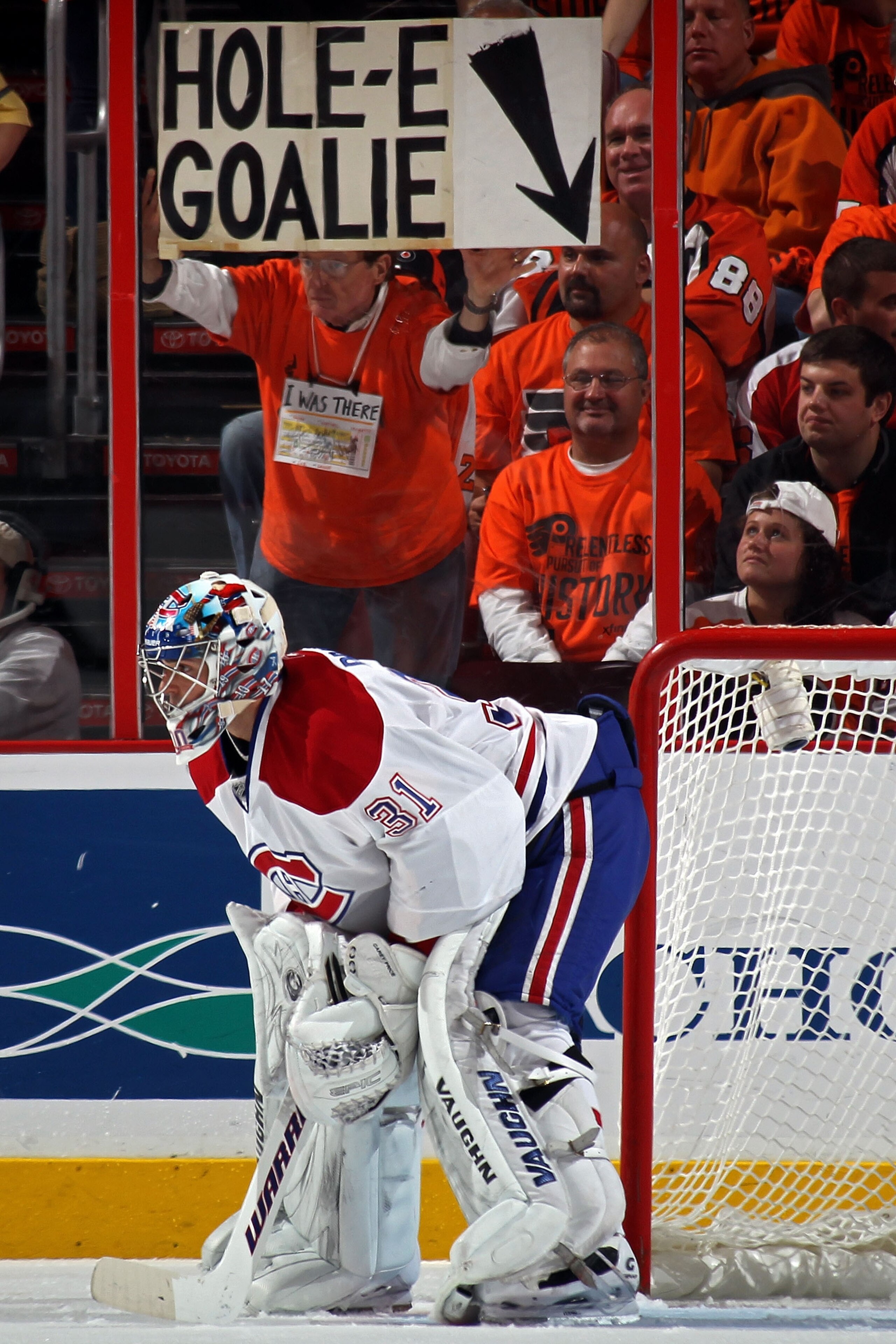 PHILADELPHIA - MAY 16:  A fan of the Philadelphia Flyers holds up a sign reading 'Hole-E Goalie' behind goalie Carey Price #31 of the Montreal Canadiens in Game 1 of the Eastern Conference Finals during the 2010 NHL Stanley Cup Playoffs at Wachovia Center