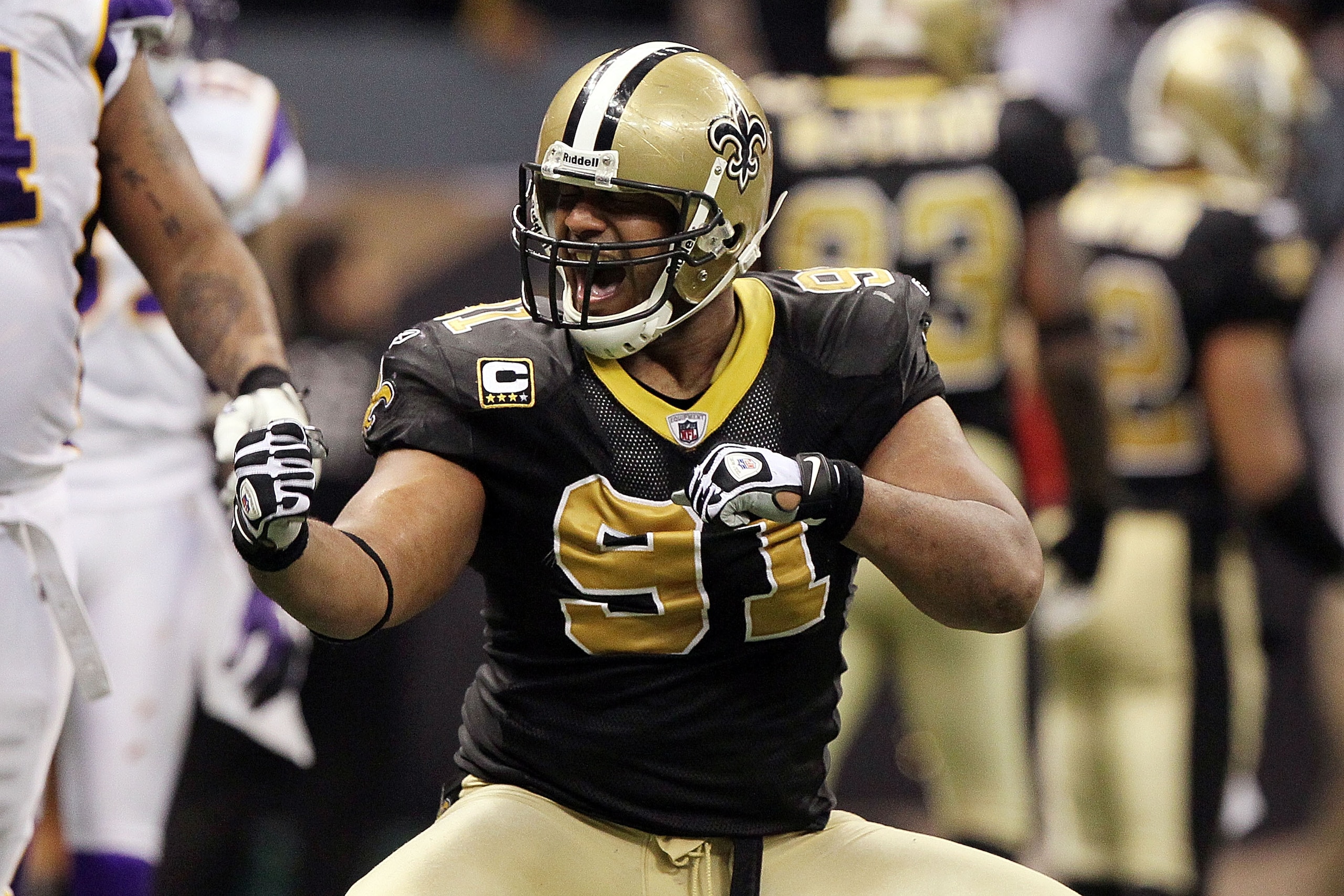 NEW ORLEANS - JANUARY 24:  Will Smith #91 of the New Orleans Saints reacts after a fumble in the fourth quarter against the Minnesota Vikings looks on during the NFC Championship Game at the Louisiana Superdome on January 24, 2010 in New Orleans, Louisian