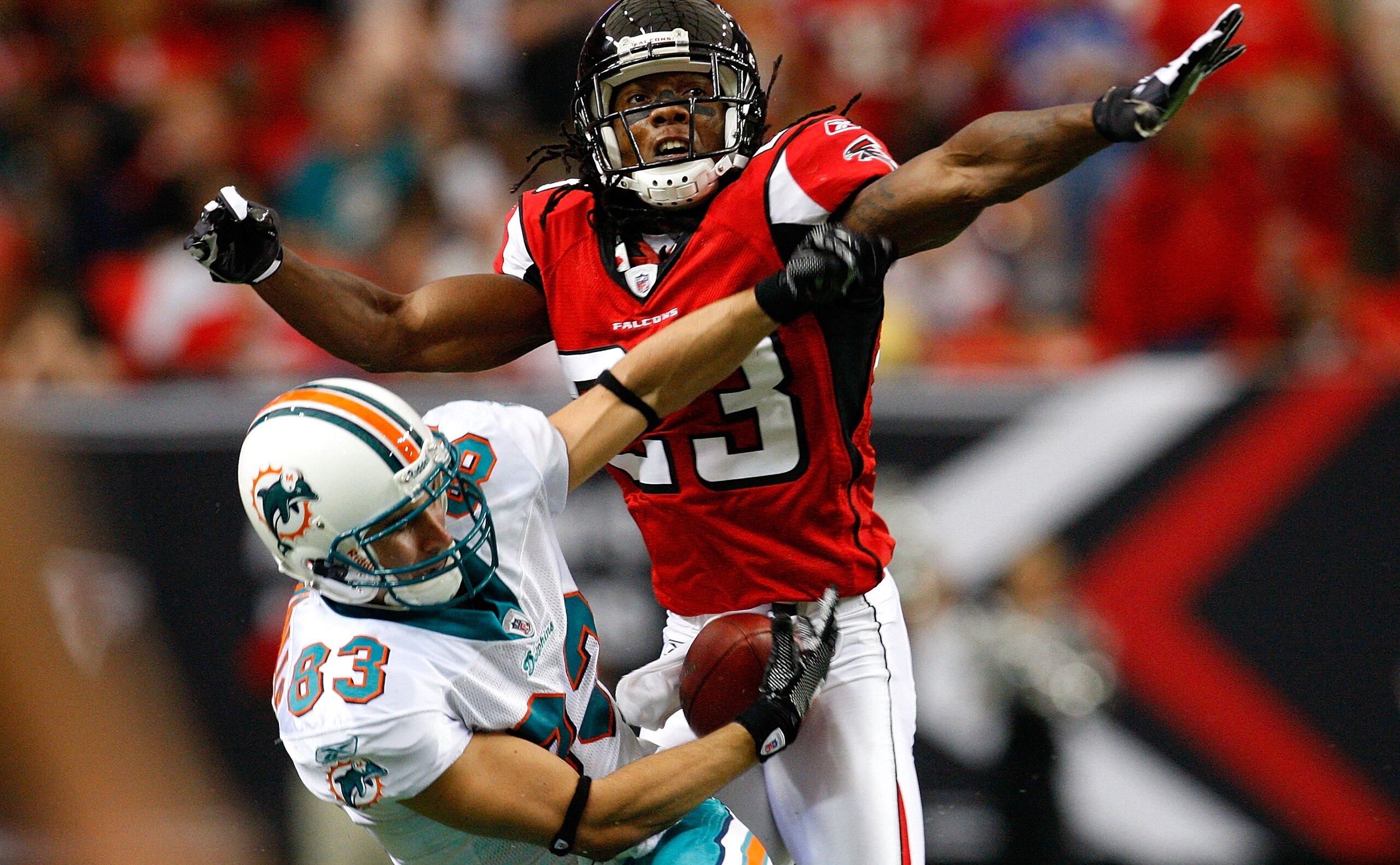 ATLANTA - SEPTEMBER 13: Greg Camarillo #83 of the Miami Dolphins fails to pull in this reception against Chris Houston #23 of the Atlanta Falcons at Georgia Dome on September 13, 2009 in Atlanta, Georgia. (Photo by Kevin C. Cox/Getty Images) ATLANTA - SEPTEMBER 13: Greg Camarillo #83 of the Miami Dolphins fails to pull in this reception against Chris Houston #23 of the Atlanta Falcons at Georgia Dome on September 13, 2009 in Atlanta, Georgia. (Photo by Kevin C. Cox/Getty Images)