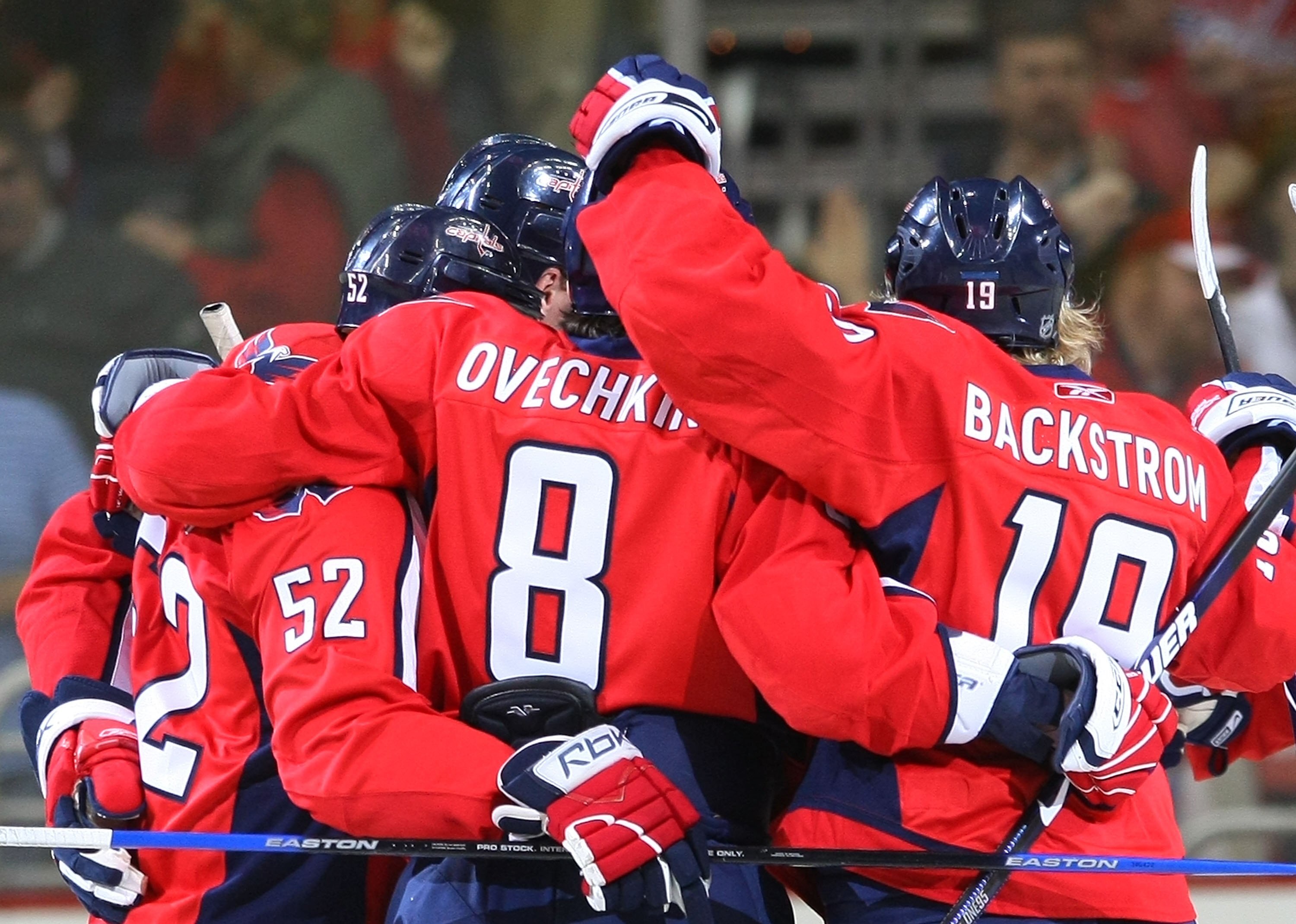 WASHINGTON - MARCH 27:  Mike Green #52, Alex Ovechkin #8 and Nicklas Backstrom #19 of the Washington Capitals celebrate Ovechkin's first period goal against the Tampa Bay Lightning on March 27, 2009 at the Verizon Center in Washington, D.C. The Capitals d
