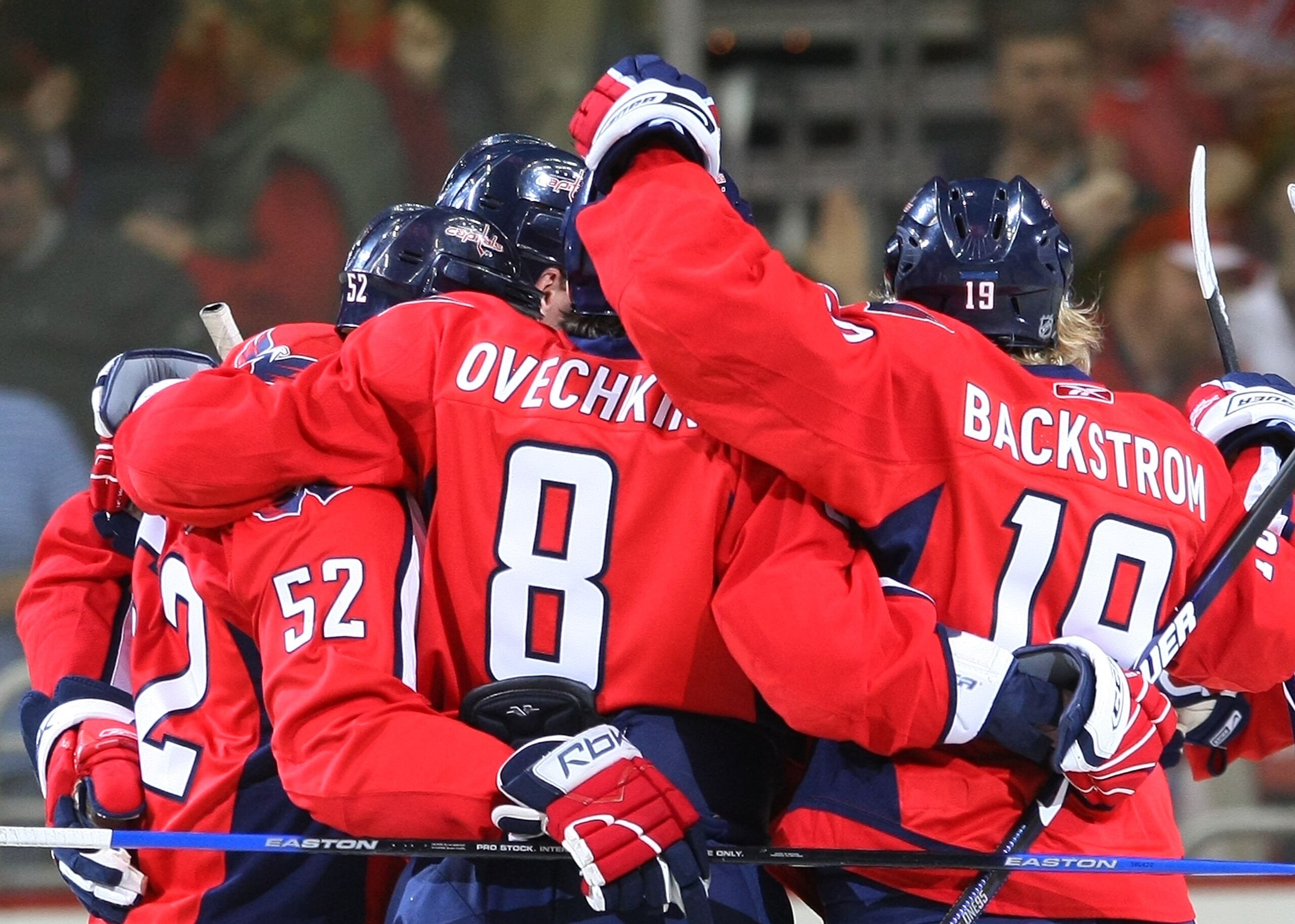 WASHINGTON - MARCH 27:  Mike Green #52, Alex Ovechkin #8 and Nicklas Backstrom #19 of the Washington Capitals celebrate Ovechkin's first period goal against the Tampa Bay Lightning on March 27, 2009 at the Verizon Center in Washington, D.C. The Capitals d