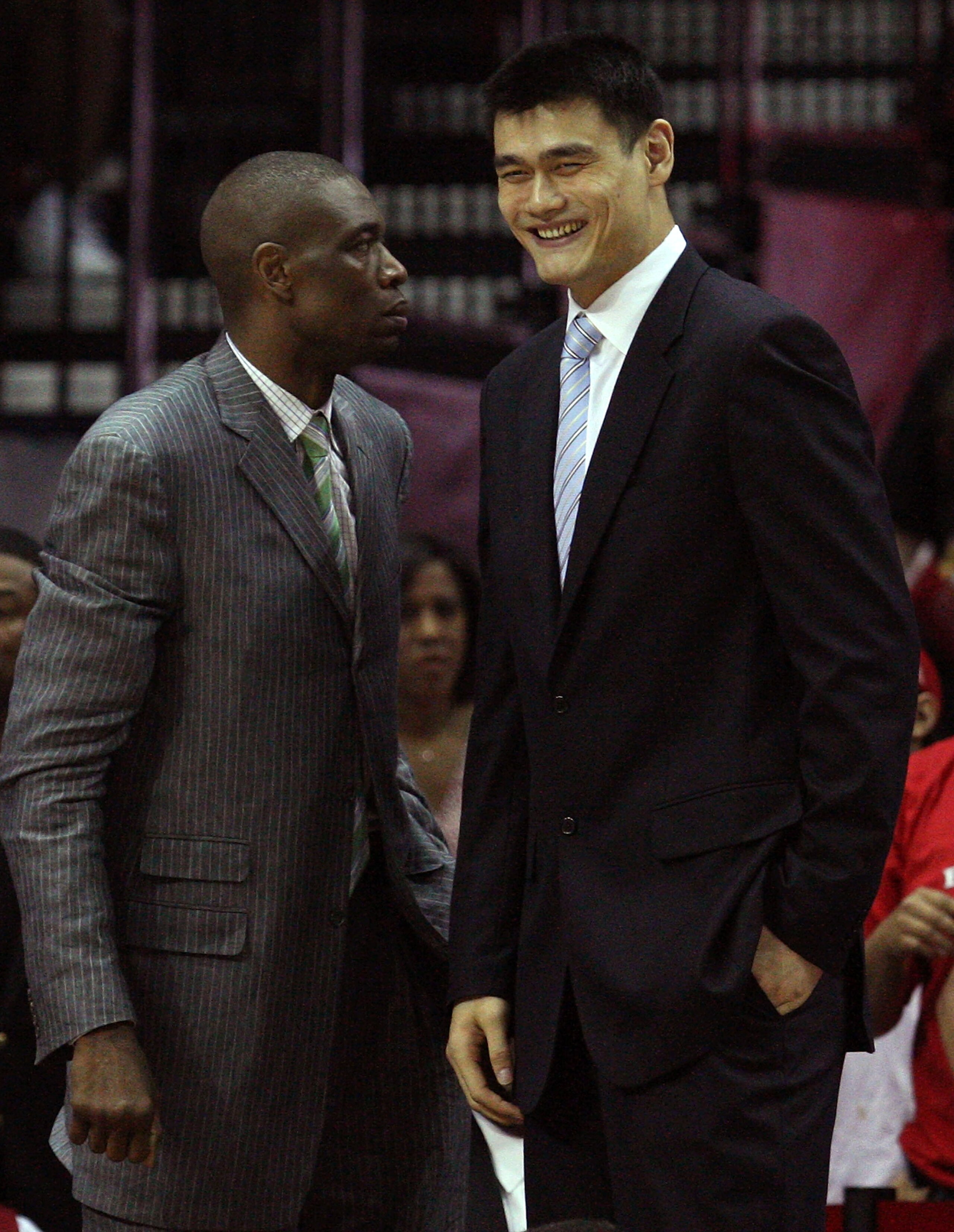 HOUSTON - MAY 10:  Center Dikembe Mutombo and Yao Ming of the Houston Rockets during Game Four of the Western Conference Semifinals during the 2009 NBA Playoffs at Toyota Center on May 10, 2009 in Houston, Texas. NOTE TO USER: User expressly acknowledges