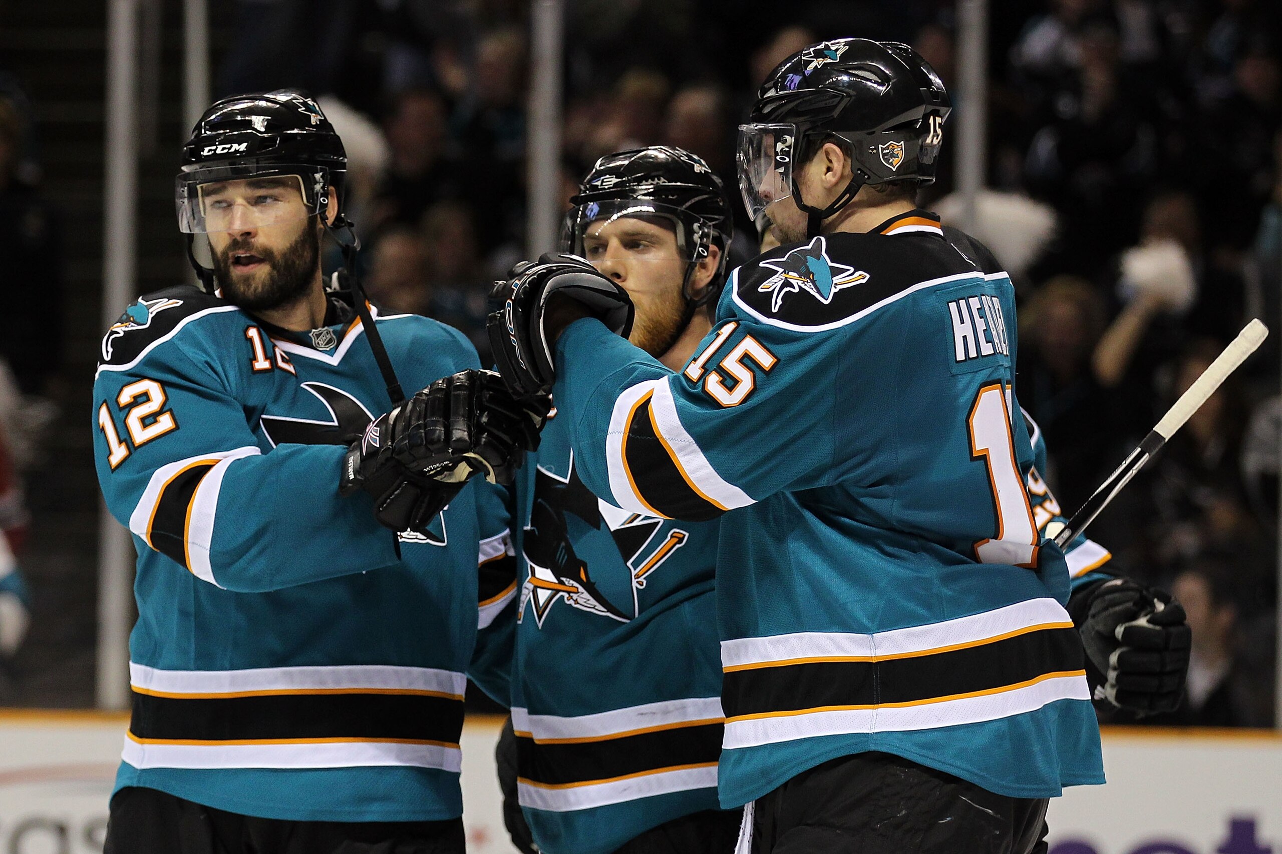 SAN JOSE, CA - MAY 18:  (L) Patrick Marleau #12 of the San Jose Sharks reacts with teammates Joe Pavelski #8 and Dany Heatley #15 after Marleau's third period goal against the Chicago Blackhawks in Game Two of the Western Conference Finals during the 2010