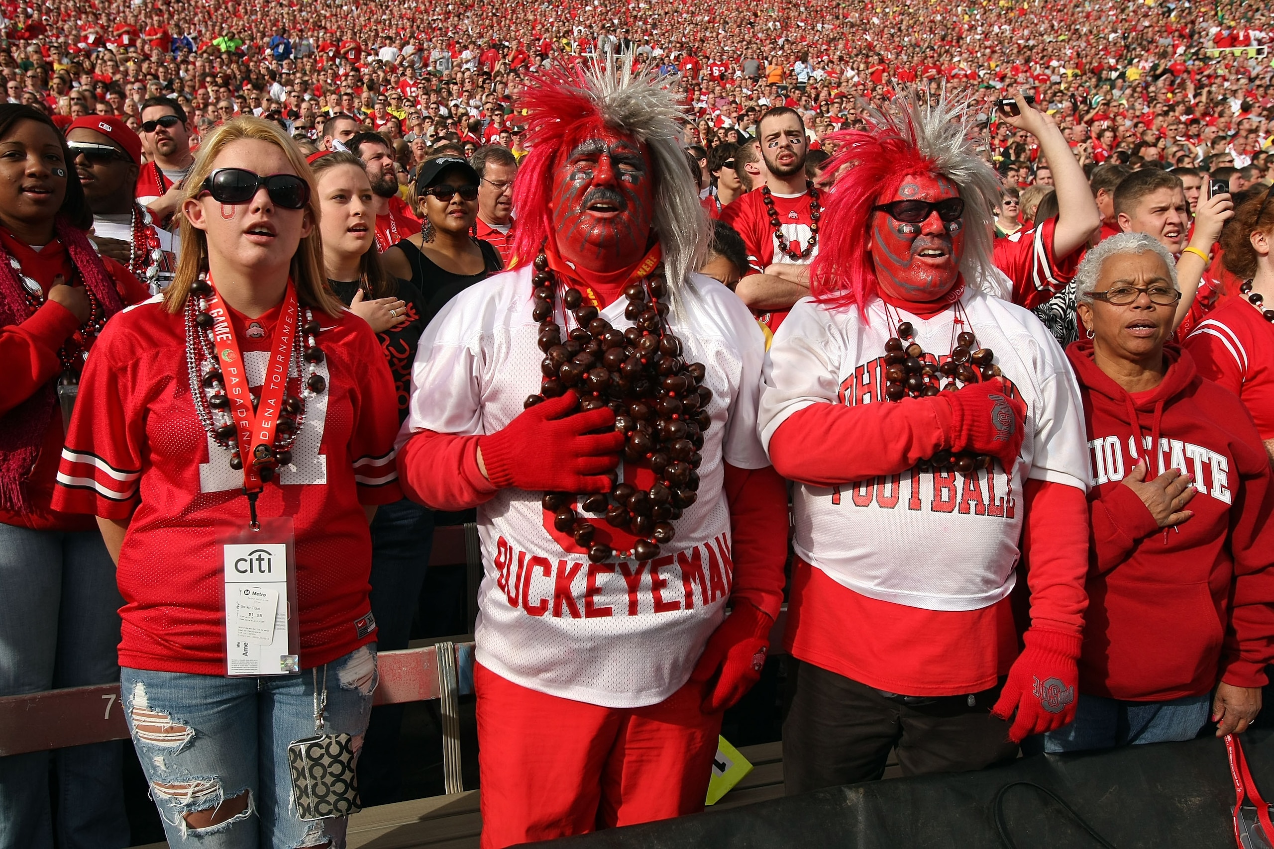 PASADENA, CA - JANUARY 01:  Fans of the Ohio State Buckeyes stand during the national anthem at the 96th Rose Bowl game against the Oregon Ducks on January 1, 2010 in Pasadena, California.  (Photo by Stephen Dunn/Getty Images)