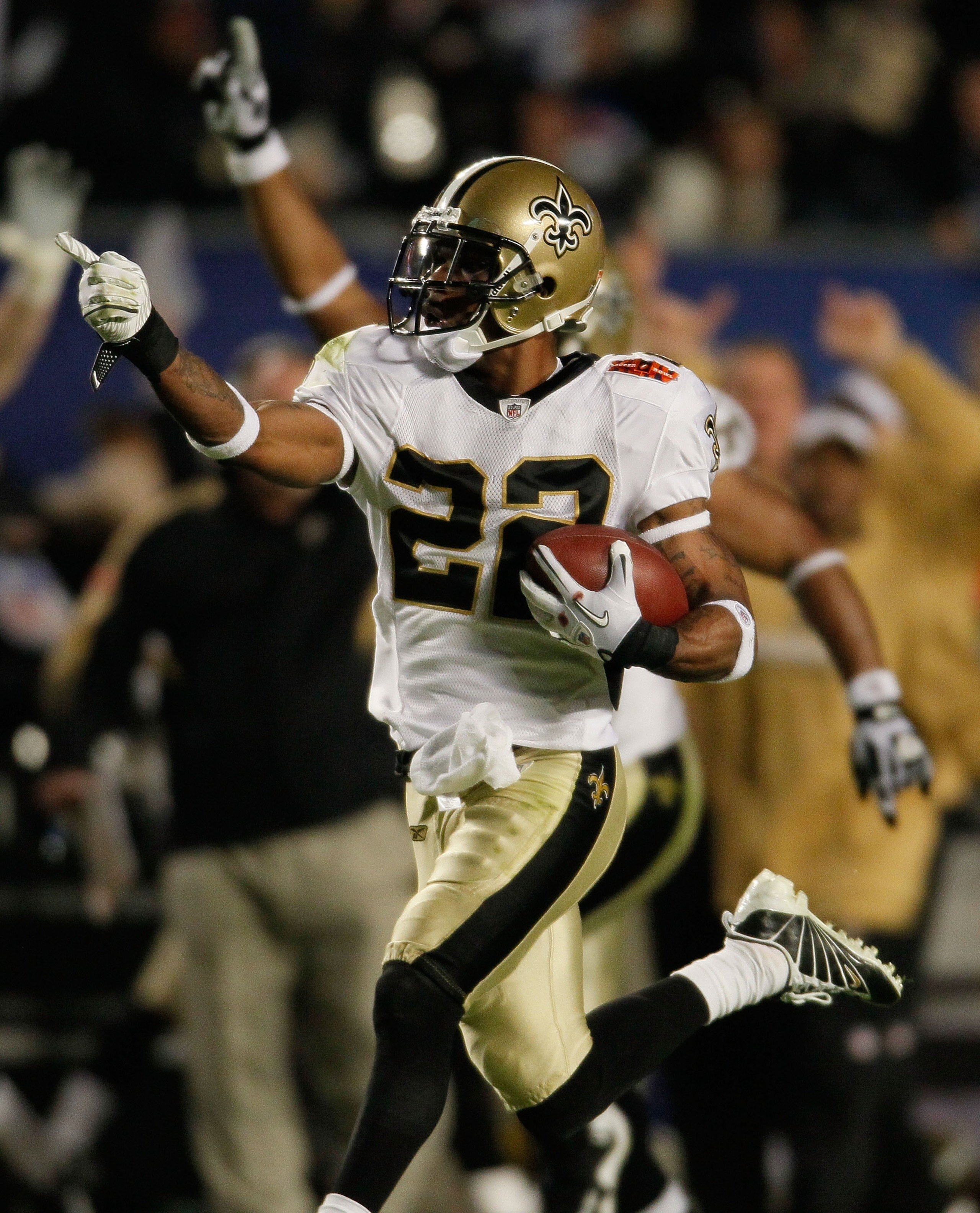 MIAMI GARDENS, FL - FEBRUARY 07:  Tracy Porter #22 of the New Orleans Saints intercepts a ball thrown by Peyton Manning of the Indianapolis Colts and returns it for a touchdown in the fourth quarter during Super Bowl XLIV on February 7, 2010 at Sun Life S