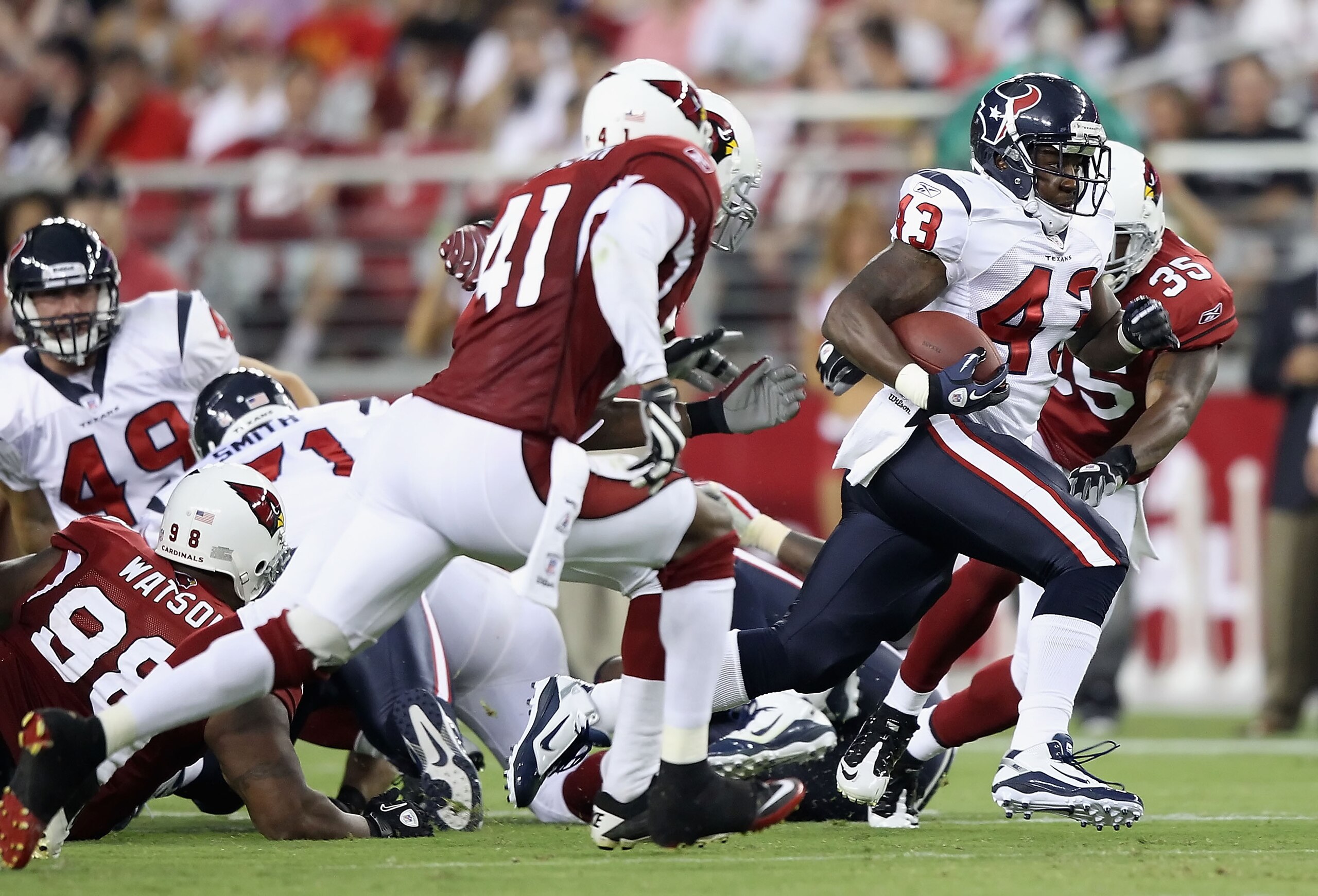 GLENDALE, AZ - AUGUST 14: Runningback Ben Tate #43 of the Houston Texans rushes the ball against the Arizona Cardinals during preseason NFL game at the University of Phoenix Stadium on August 14, 2010 in Glendale, Arizona. The Cardinals defeated the Texa GLENDALE, AZ - AUGUST 14: Runningback Ben Tate #43 of the Houston Texans rushes the ball against the Arizona Cardinals during preseason NFL game at the University of Phoenix Stadium on August 14, 2010 in Glendale, Arizona. The Cardinals defeated the Texa