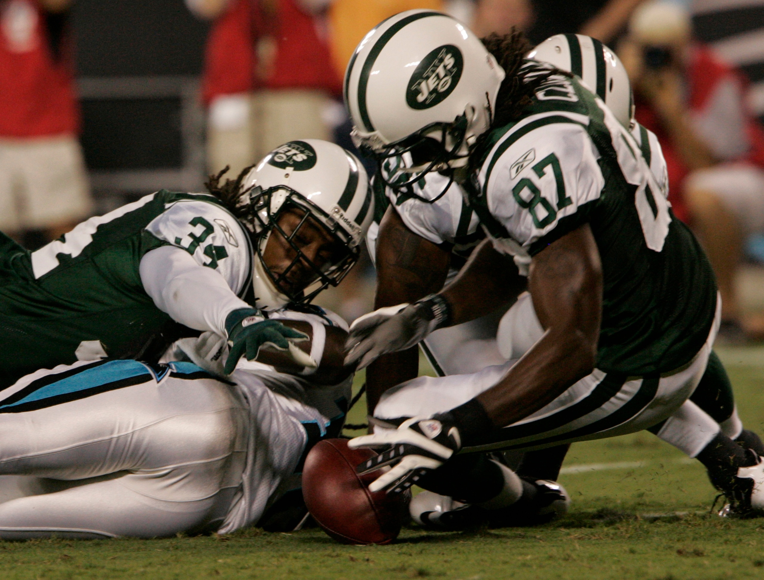 CHARLOTTE,NC- AUGUST 21: Armanti Edwards #10 of the Carolina Panthers fumbles the ball as David Clowney #87 and Marquice Cole #34 of the New York Jets recover the ball during a preseason game at Bank of America Stadium on August 21, 2010 in Charlotte, No CHARLOTTE,NC- AUGUST 21: Armanti Edwards #10 of the Carolina Panthers fumbles the ball as David Clowney #87 and Marquice Cole #34 of the New York Jets recover the ball during a preseason game at Bank of America Stadium on August 21, 2010 in Charlotte, No
