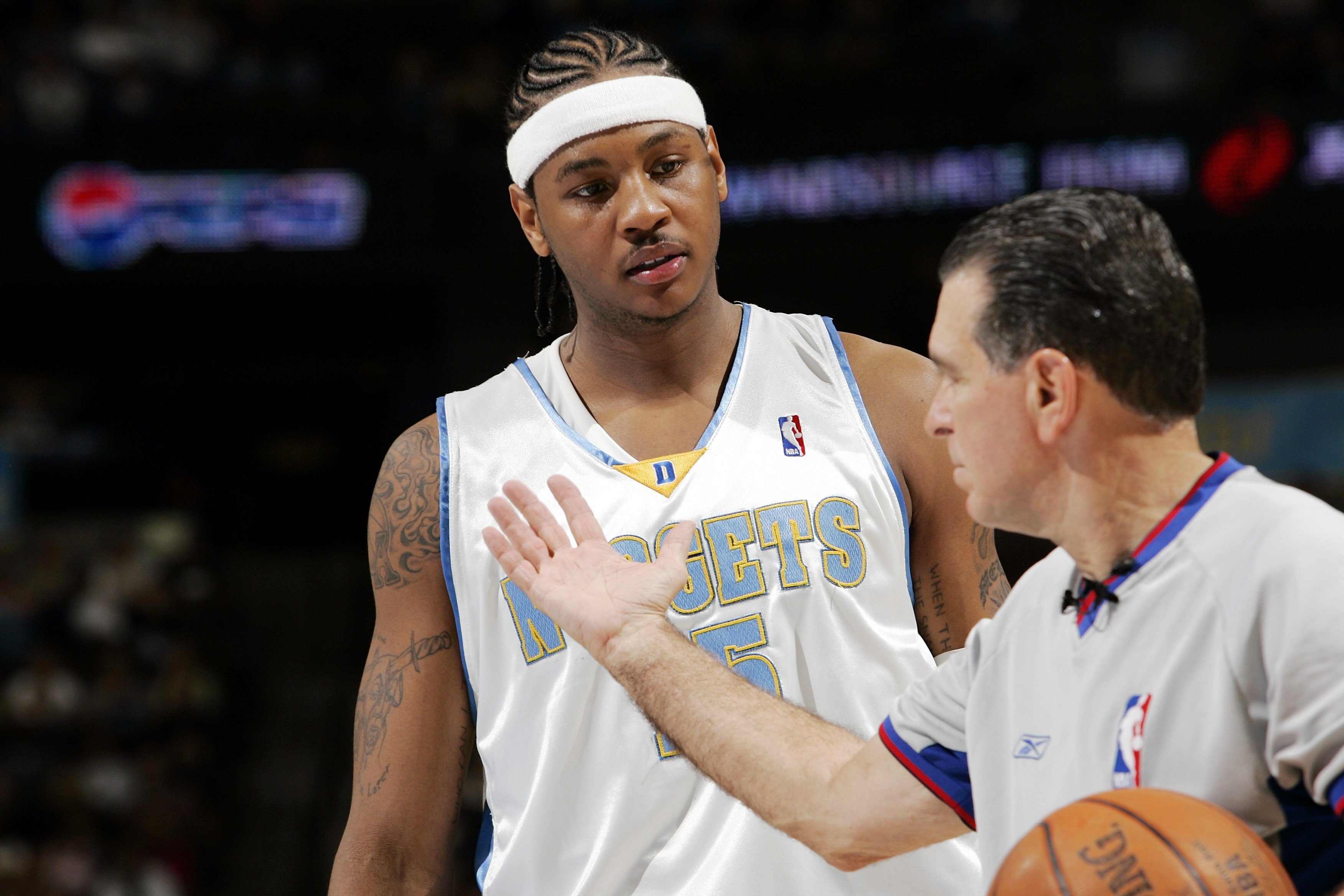 DENVER - MARCH 29:  Carmelo Anthony #15 of the Denver Nuggets looks at official Joe Forte #45 of the Utah Jazz after complaining and picking up a technical foul in the fourth quarter on March 29, 2006 at the Pepsi Center in Denver, Colorado.  The Jazz won
