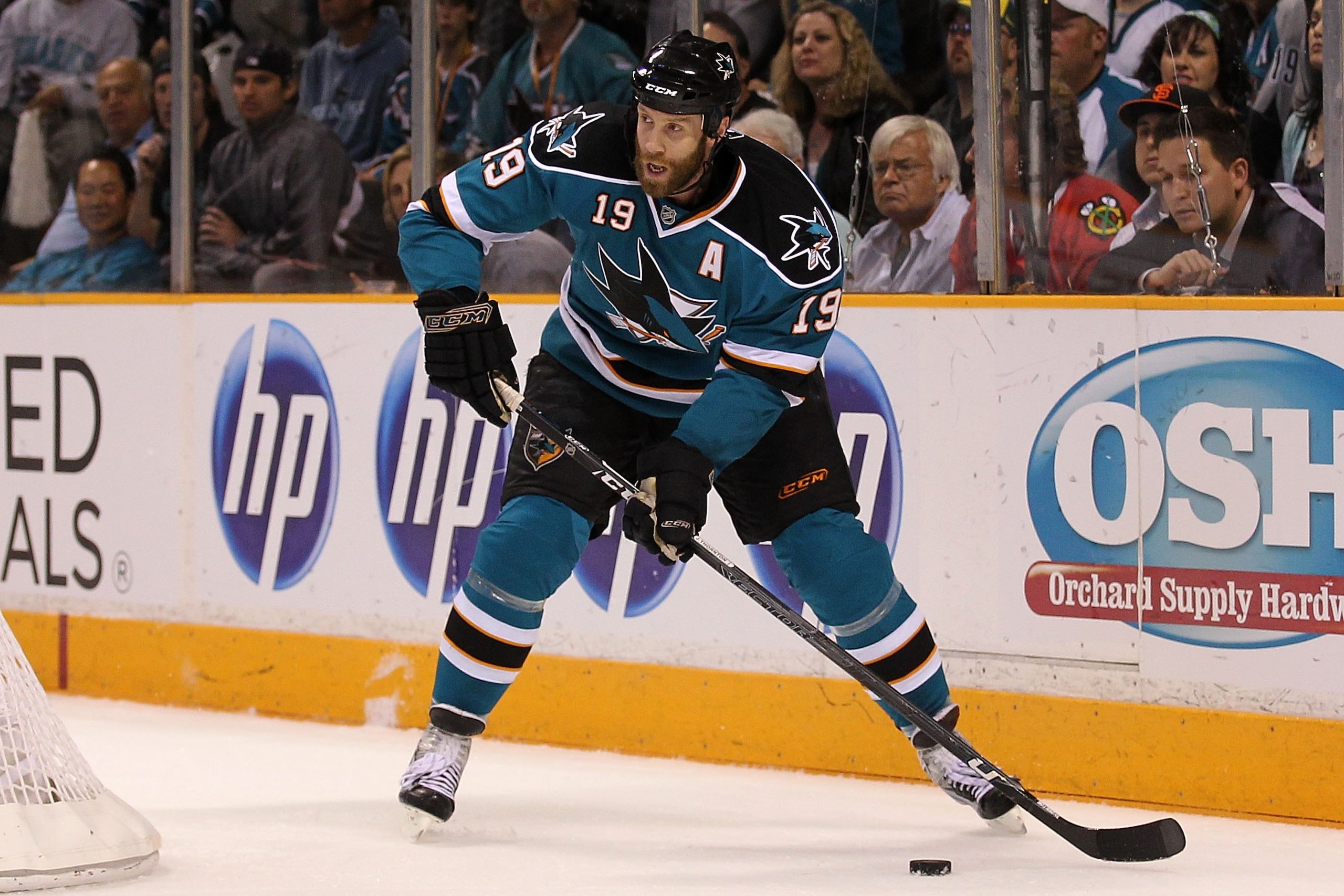 SAN JOSE, CA - MAY 18:  Joe Thornton #19 of the San Jose Sharks moves the puck while taking on the Chicago Blackhawks in Game Two of the Western Conference Finals during the 2010 NHL Stanley Cup Playoffs at HP Pavilion on May 18, 2010 in San Jose, Califor
