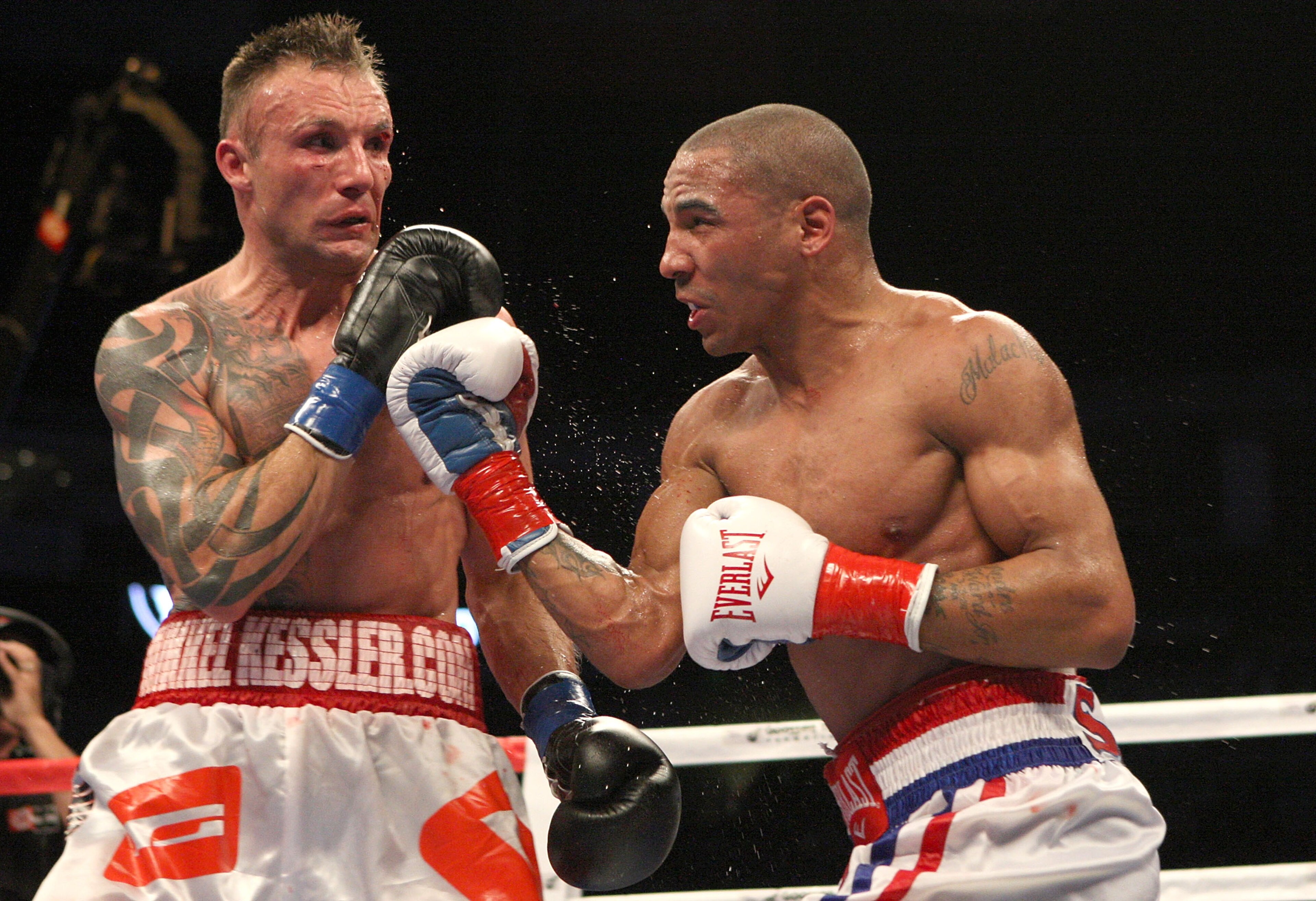 OAKLAND, CA - NOVEMBER 21:  Mikkel Kessler of Denmark (L) is hit by Andre Ward during their WBA Super Middleweight Championship Bout at the Oakland-Alameda County Coliseum on November 21, 2009 in Oakland, California.  (Photo by Jed Jacobsohn/Getty Images)