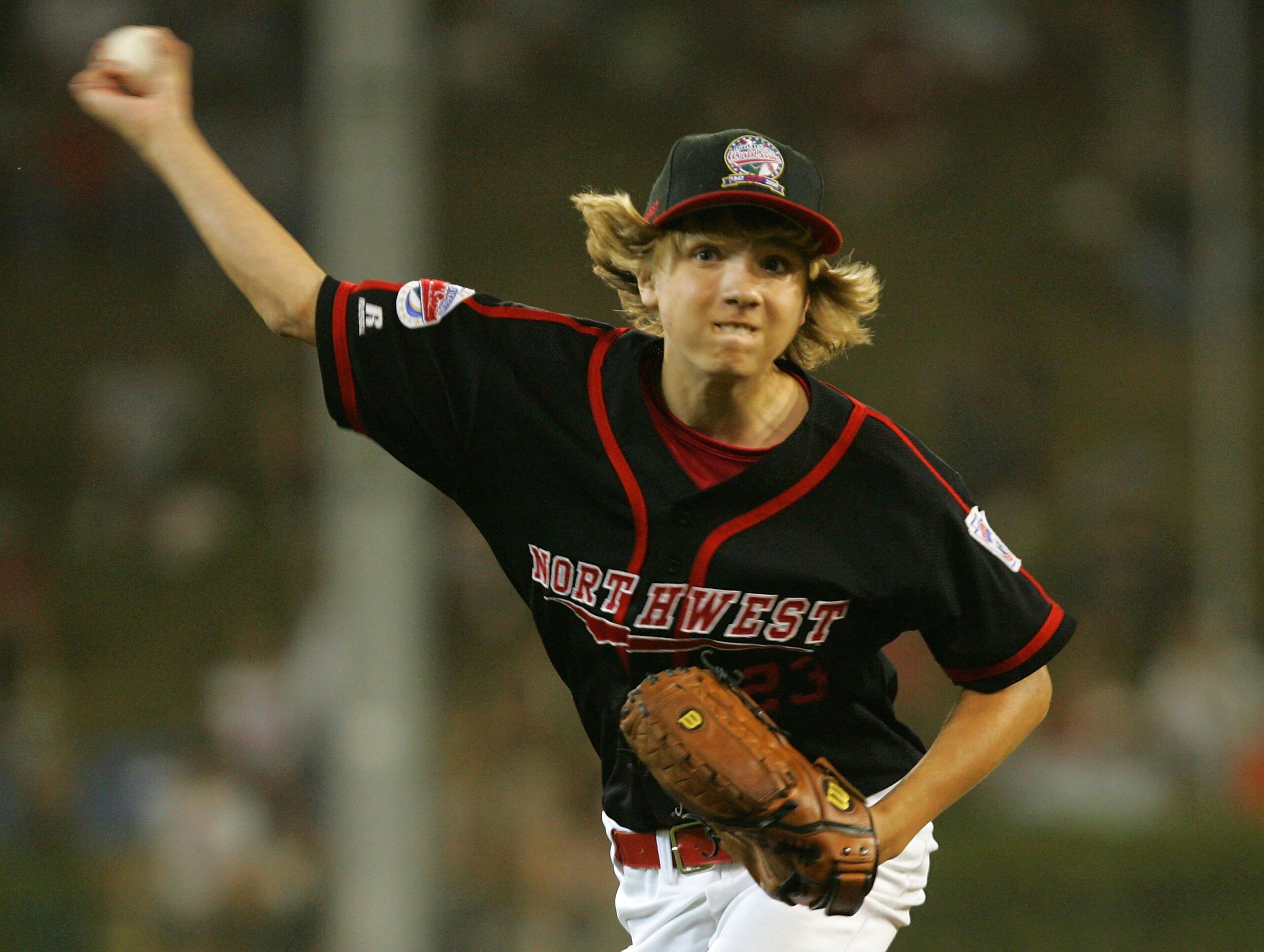 SOUTH WILLIAMSPORT, PA - AUGUST 23:  Devon DeJardin #23 of the Northwest team from Oregon delivers a pitch against the Great Lakes team from Illinois during the United States Semifinal game in the Little League World Series on August 23, 2006 at Lamade St