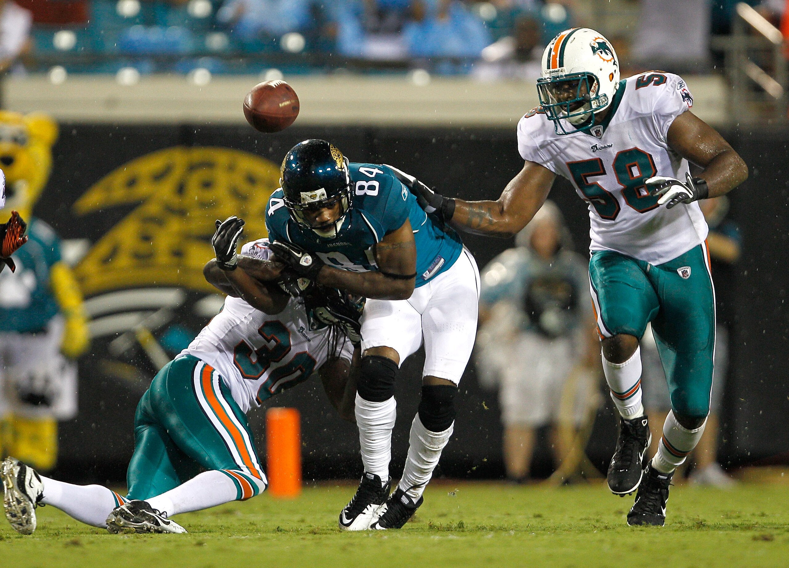 JACKSONVILLE, FL - AUGUST 21:  Chris Clemons #30 of the Miami Dolphins breaks a pass intended for Troy Williamson #84 of the Jacksonville Jaguars during the preseason game at EverBank Field on August 21, 2010 in Jacksonville, Florida.  (Photo by Sam Green