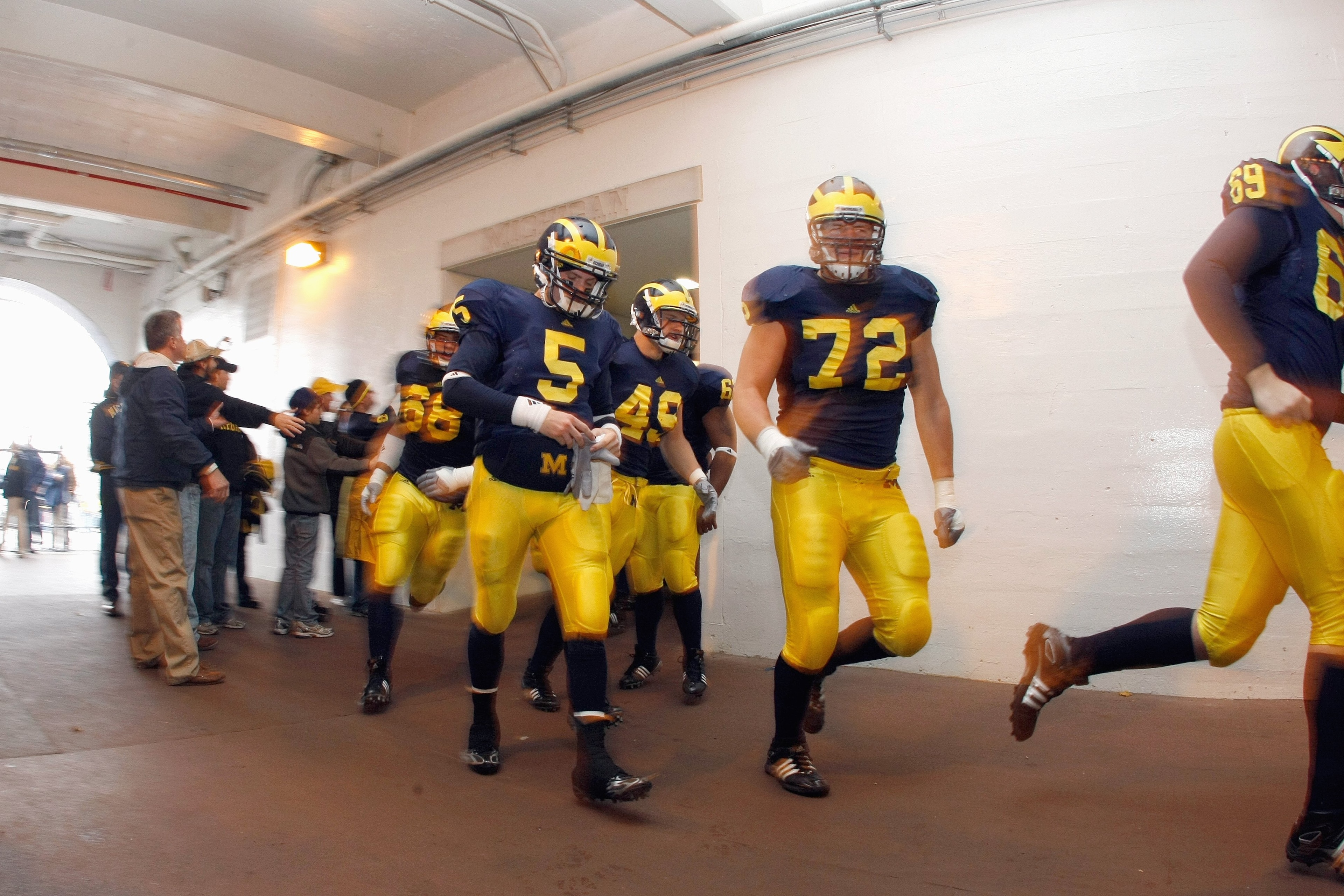 ANN ARBOR, MI - NOVEMBER 21: Quarteback Tate Forcier #5 of the Michigan Wolverines walks through the tunnel before the game against the Ohio State Buckeyes on November 21, 2009 at Michigan Stadium in Ann Arbor, Michigan. Ohio State won the game 21-10. (Ph