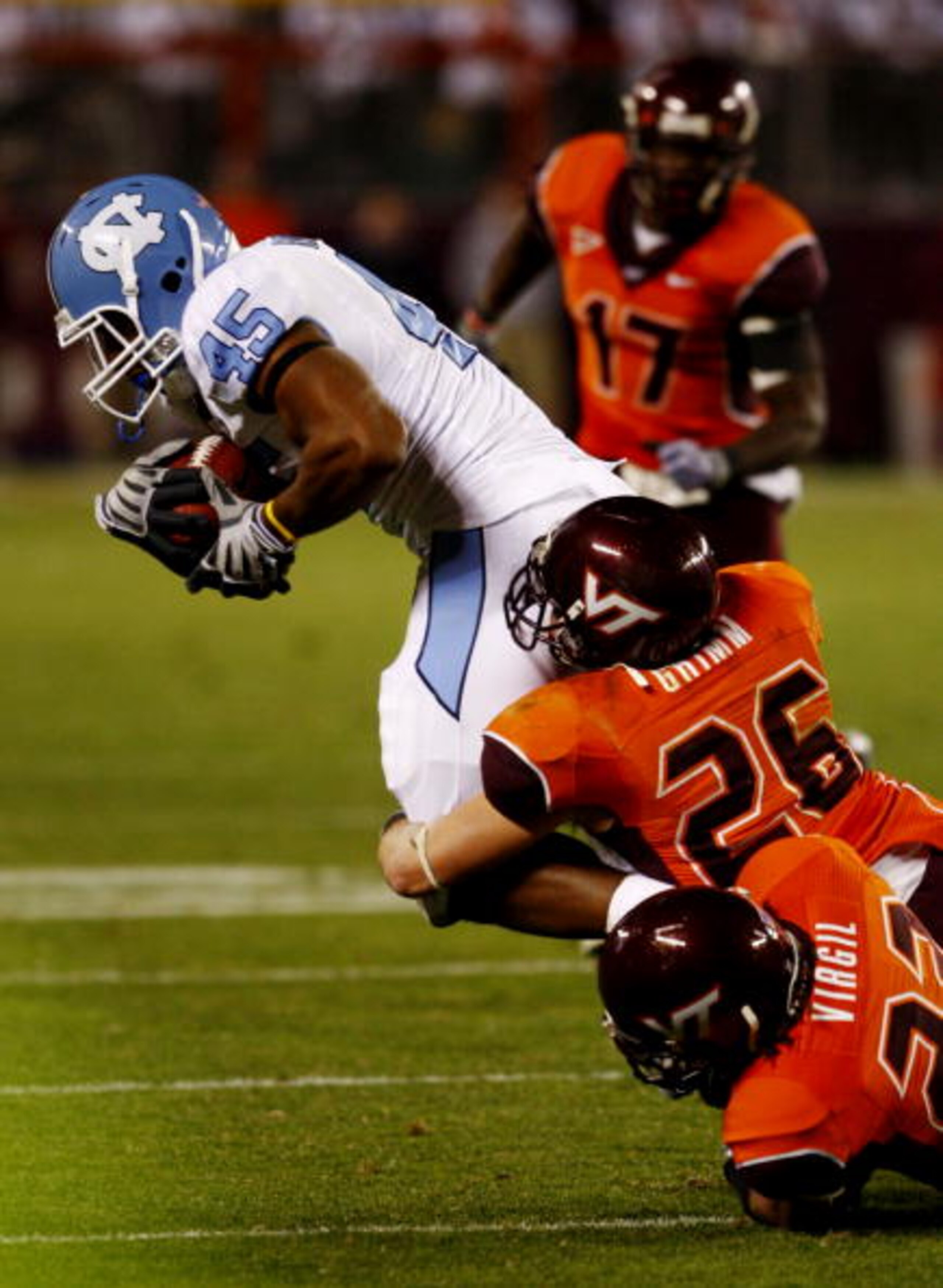 BLACKSBURG, VA - OCTOBER 29:  Josh Bridges #45 of the North Carolina Tar Heels is tackled by the Virginia Tech University Hokies defense during the fourth quarter of the game at Lane Stadium on October 29, 2009 in Blacksburg, Virginia.  The Tar Heels won