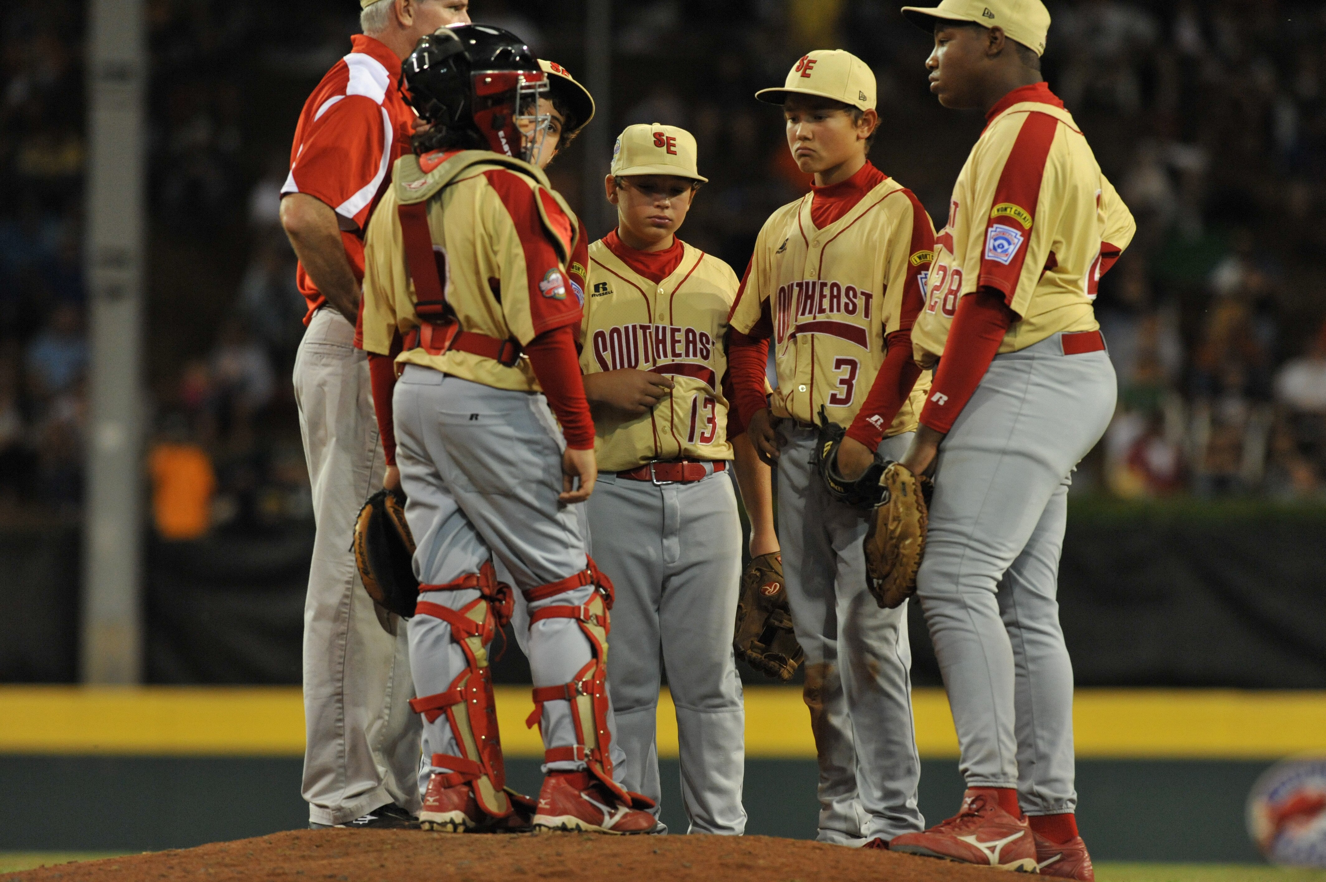 WILLIAMSPORT, PA - AUGUST 27: Shortstop Blake Jackson #3 and his teammates confer at the mound after being scored upon by the Southeast (Georgia) during the game against the West (California)  in the US semifinal at Lamade Stadium on August 27, 2009 in Wi